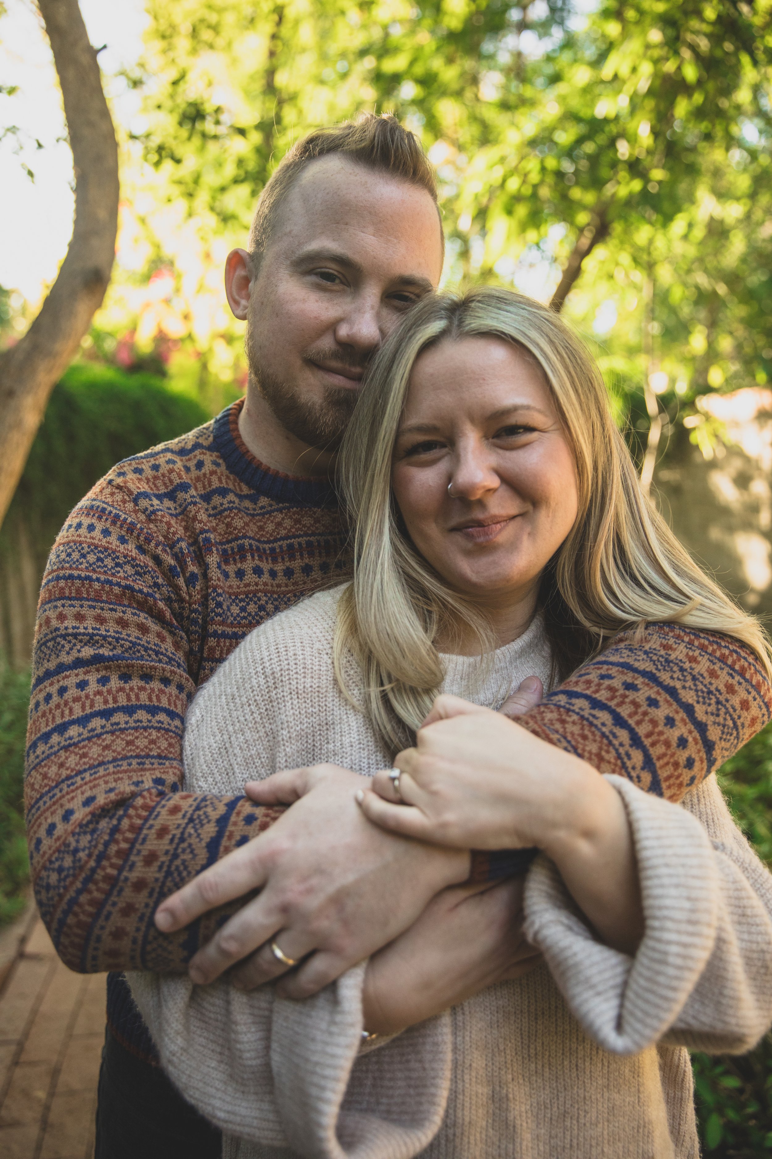 Couple hold hands bare feet outside during their in-home engagement photo session with Phoenix based romantic engagement photographer; Jennifer Lind Schutsky. 