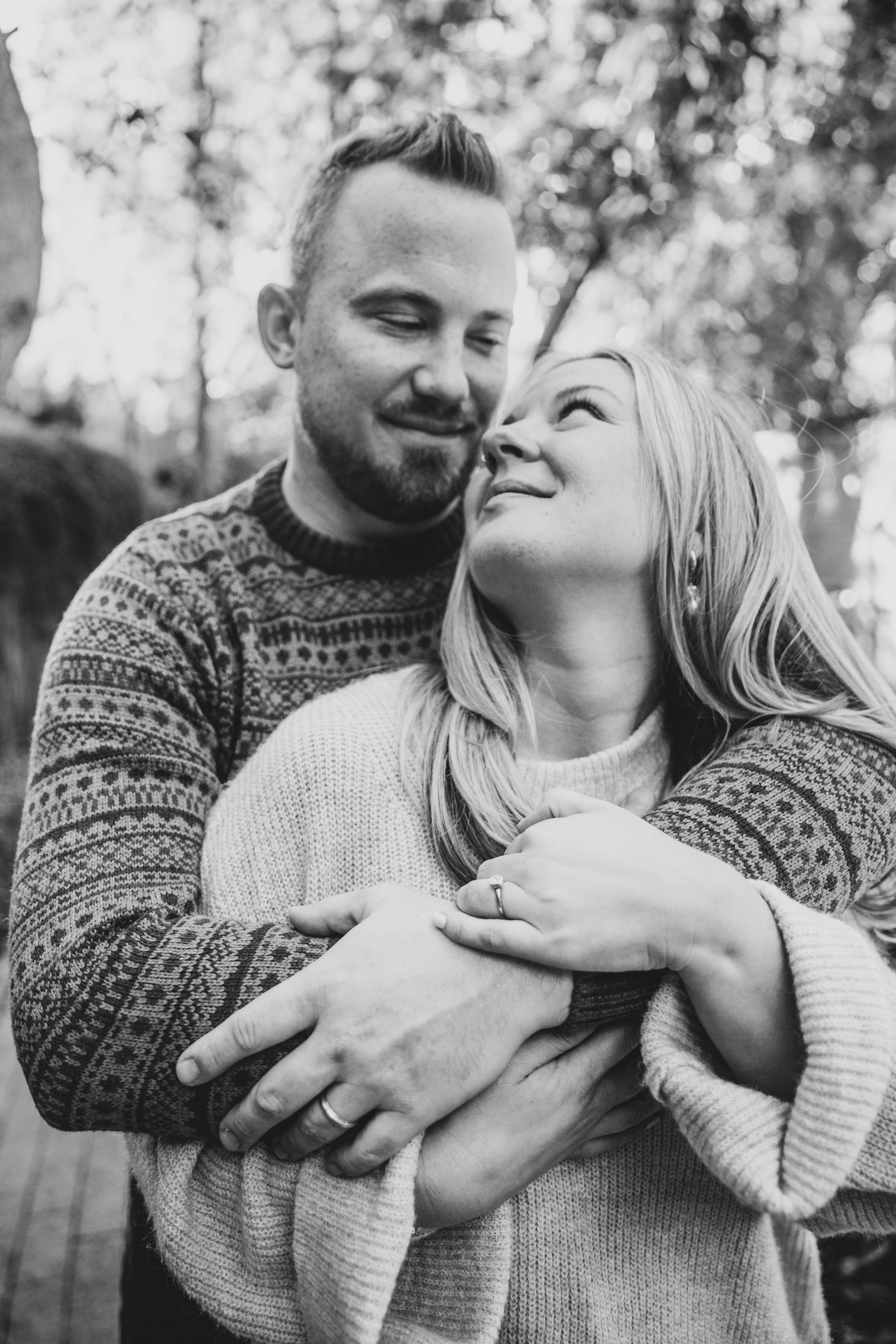 Couple hold hands bare feet outside during their in-home engagement photo session with Phoenix based romantic engagement photographer; Jennifer Lind Schutsky. 