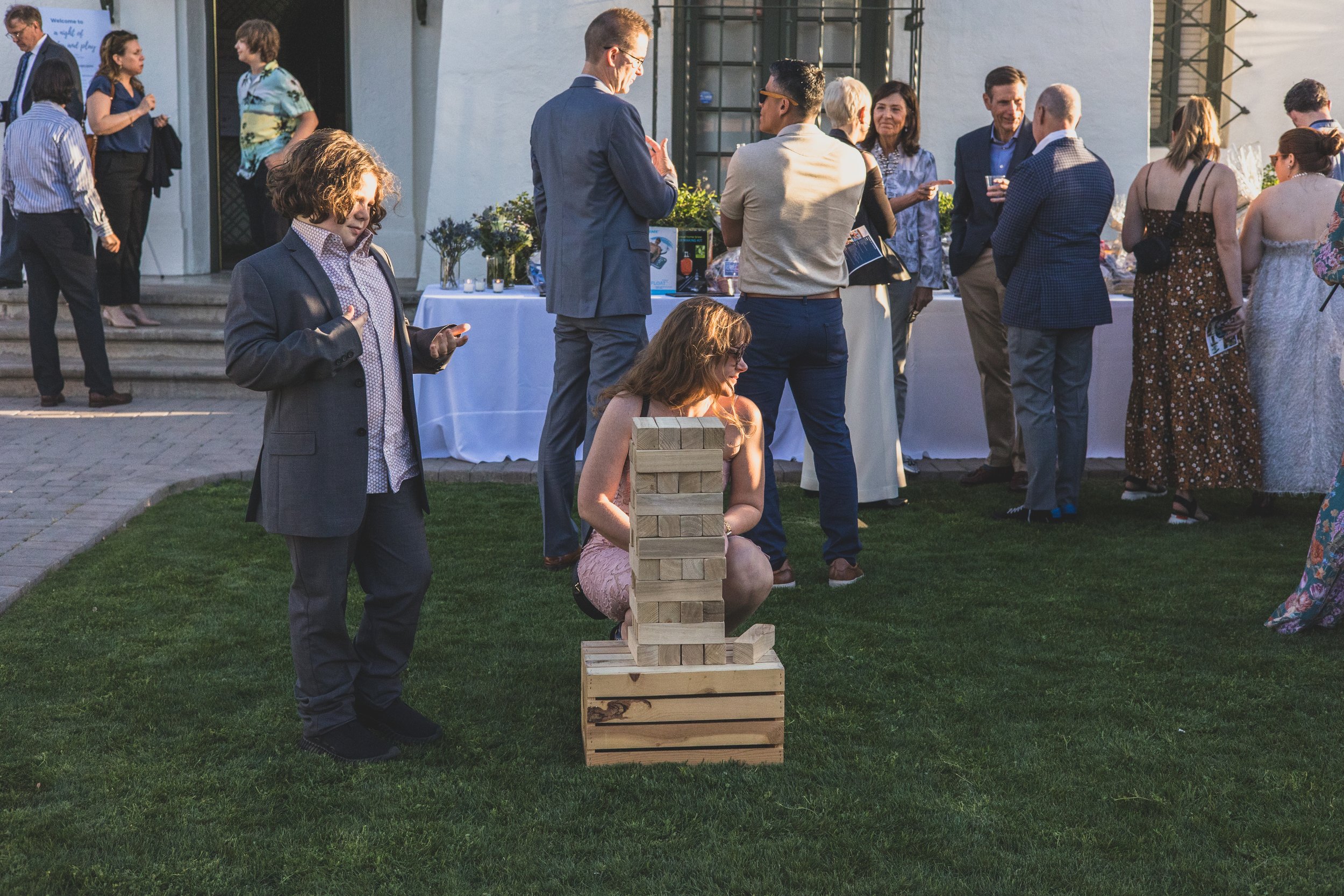 Guests at a Sunset Private Corporate on the lawn of Historic Downtown Phoenix's newest venue, the Coronado House by Corporate Event Photographer in Phoenix; Jennifer Lind Schutsky.