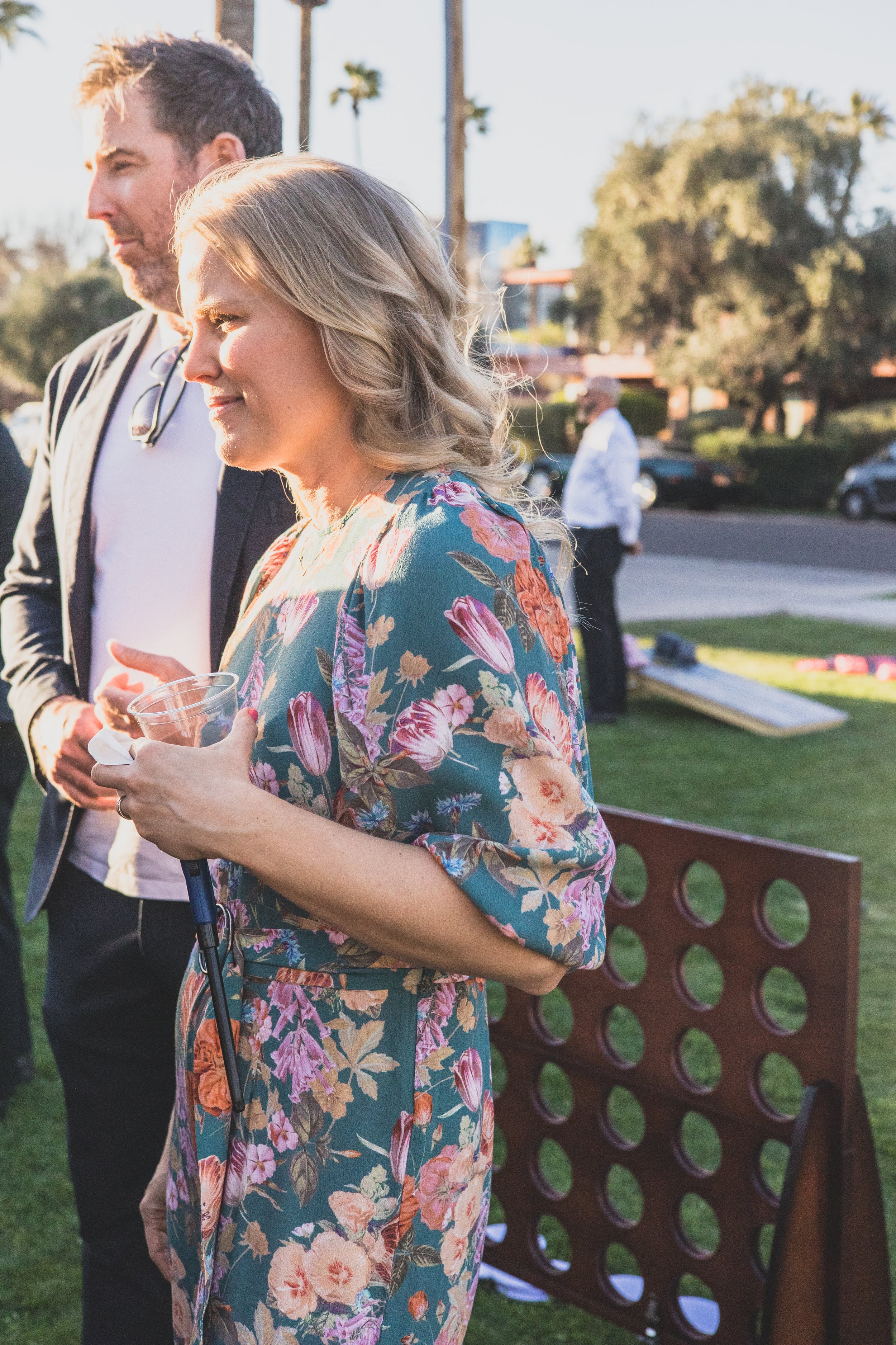 Guests talking at a Private Corporate at sunset in the Coronado House a Historic Downtown Phoenix's newest venue, by Candid Corporate Event Photographer; Jennifer Lind Schutsky.