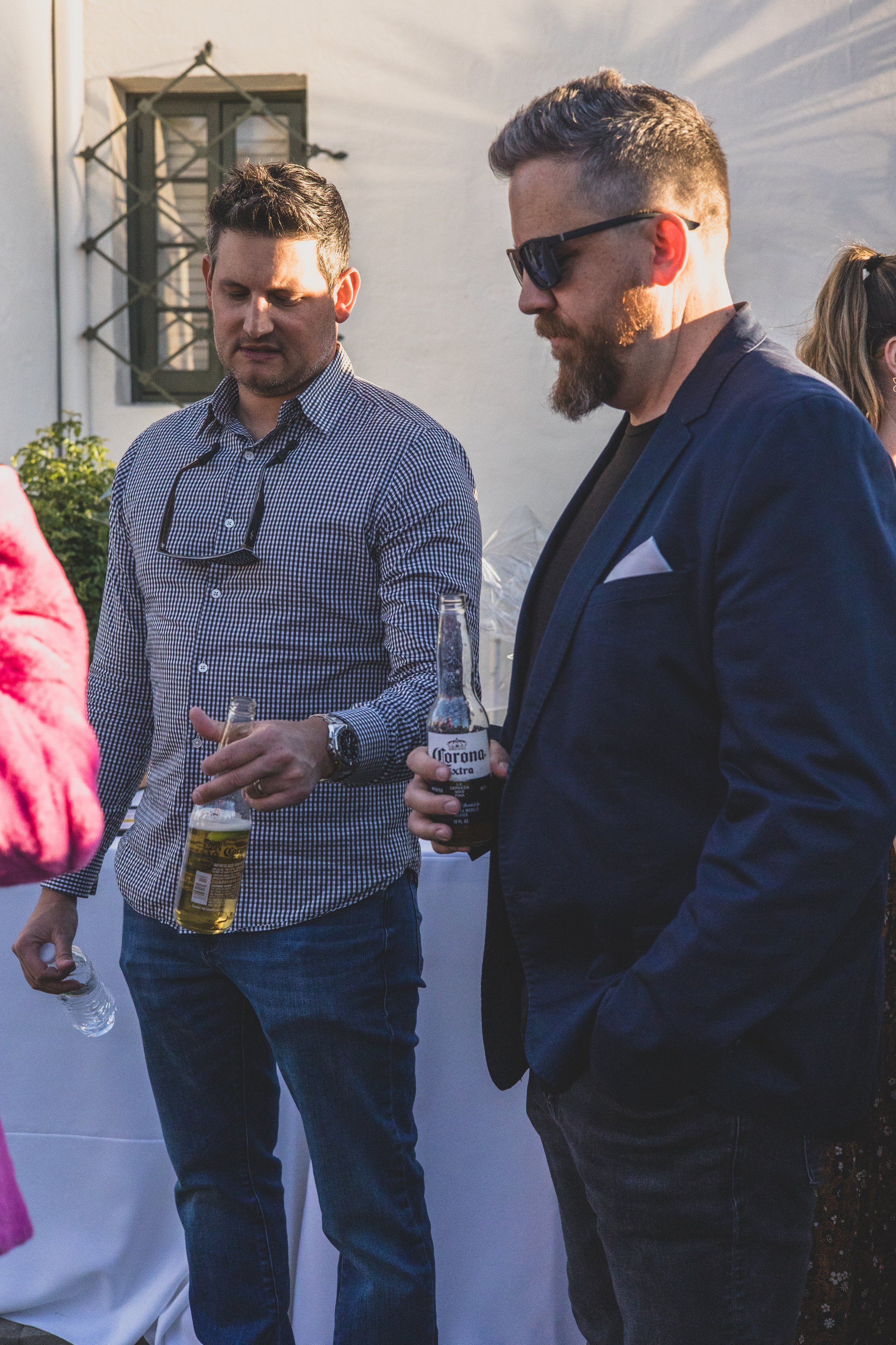 Guests talking at a Private Corporate at sunset in the Coronado House a Historic Downtown Phoenix's newest venue, by Candid Corporate Event Photographer; Jennifer Lind Schutsky.