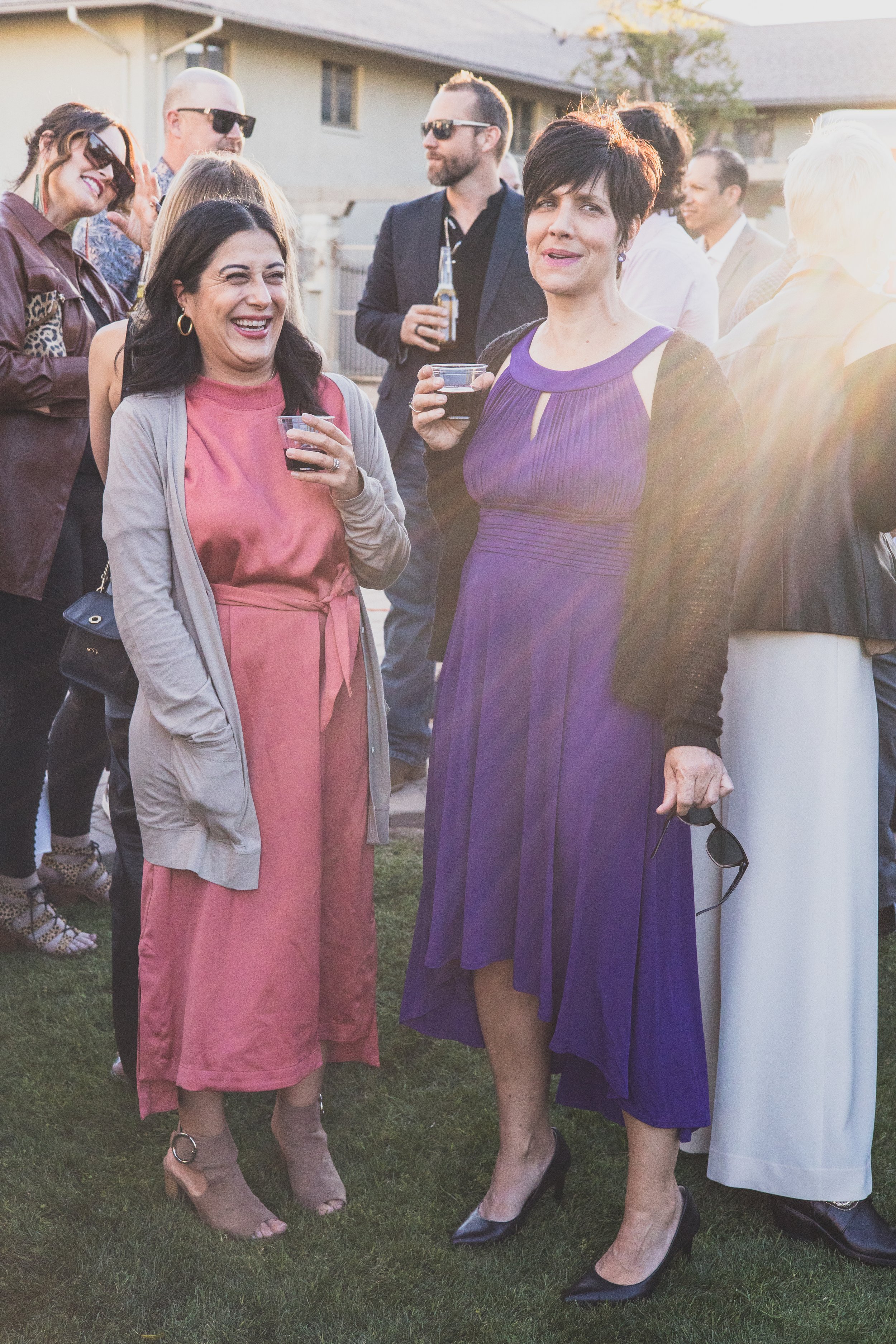 Guests talking at a Private Corporate at sunset in the Coronado House a Historic Downtown Phoenix's newest venue, by Candid Corporate Event Photographer; Jennifer Lind Schutsky.