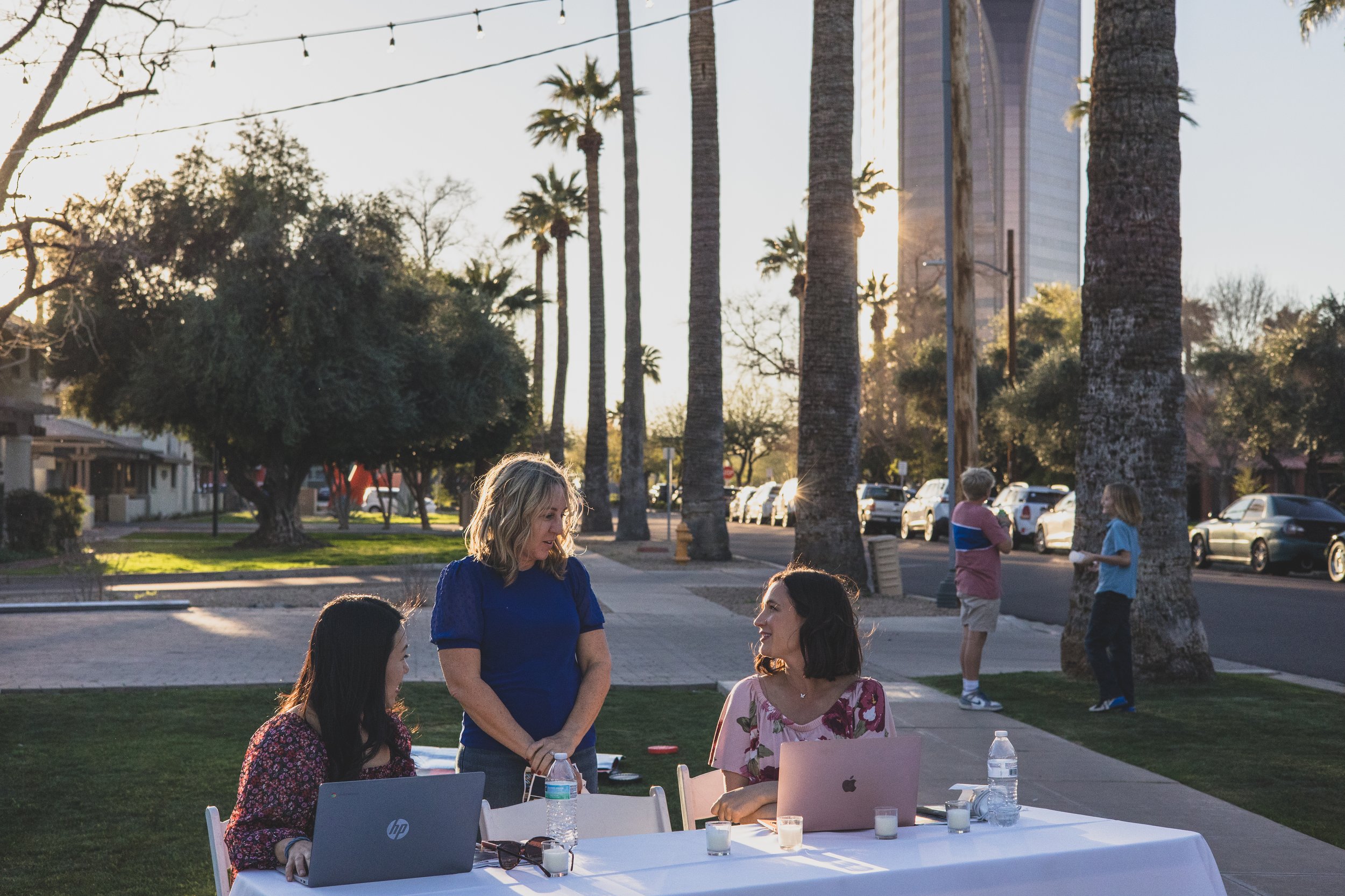 Guests having fun at a Private Corporate at sunset in the Coronado House a Historic Downtown Phoenix's newest venue, by Candid Corporate Event Photographer; Jennifer Lind Schutsky.