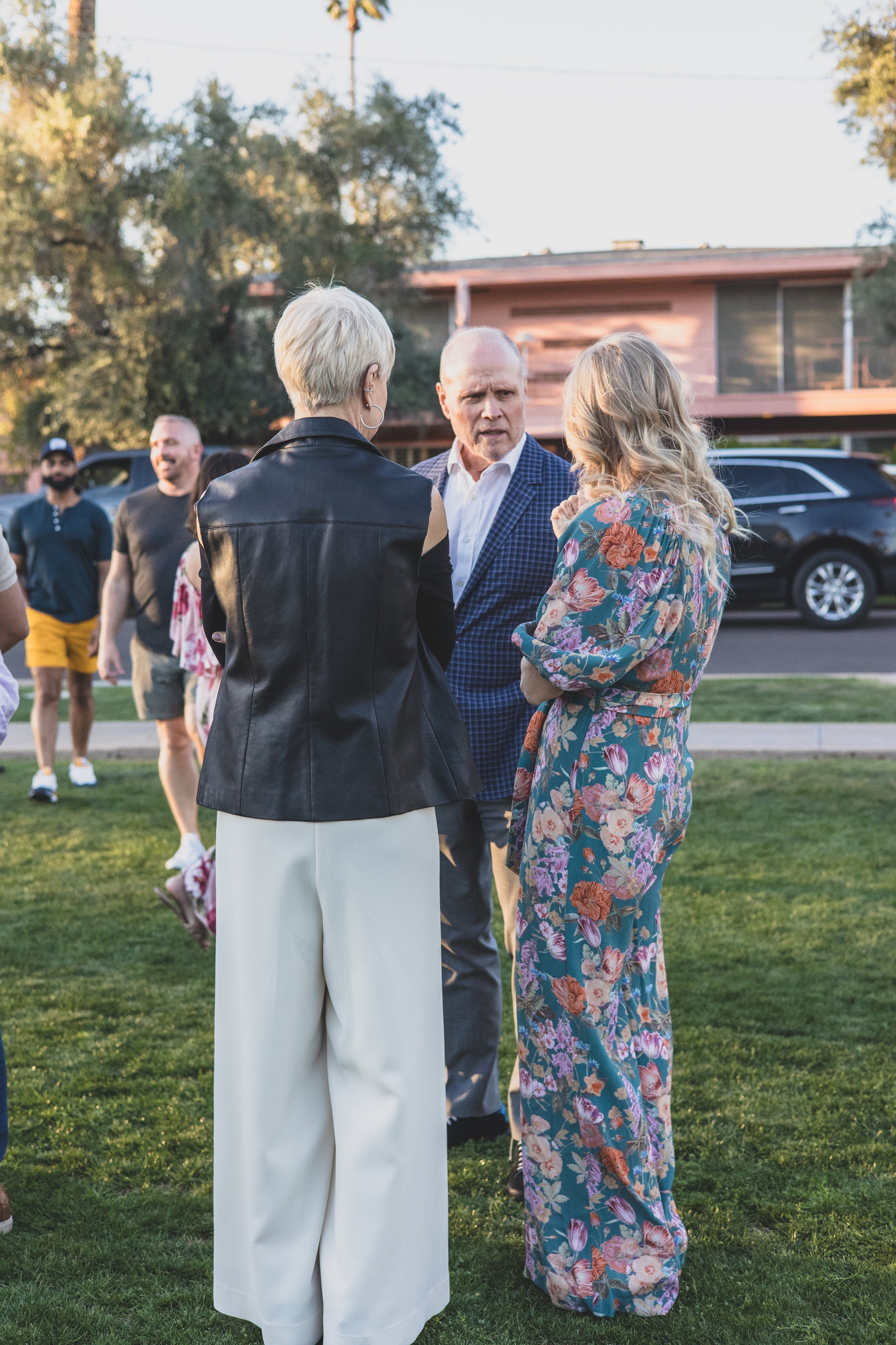 Guests talking at a Private Corporate at sunset in the Coronado House a Historic Downtown Phoenix's newest venue, by Candid Corporate Event Photographer; Jennifer Lind Schutsky.