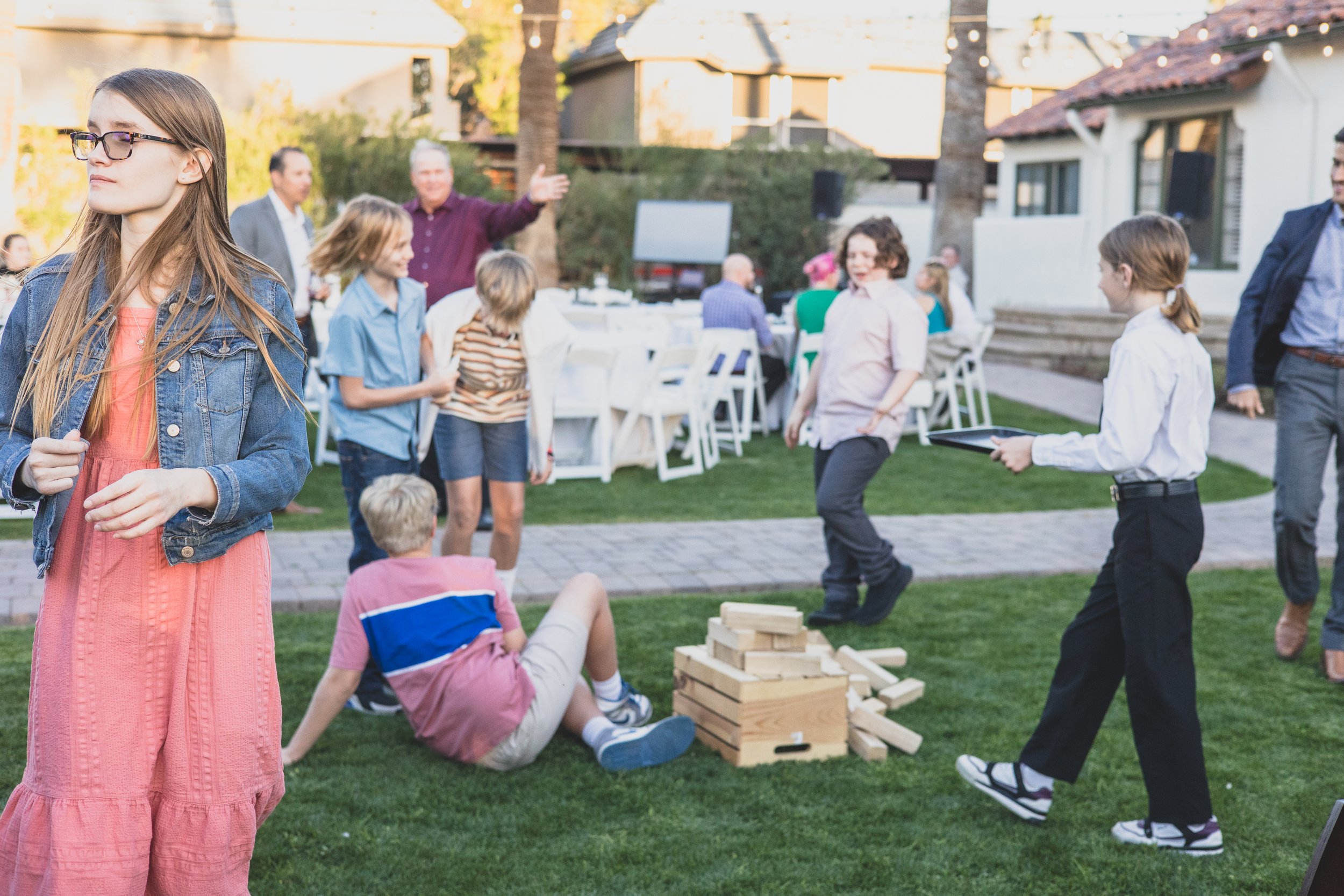 Guests having fun at a Private Corporate at sunset in the Coronado House a Historic Downtown Phoenix's newest venue, by Candid Corporate Event Photographer; Jennifer Lind Schutsky.