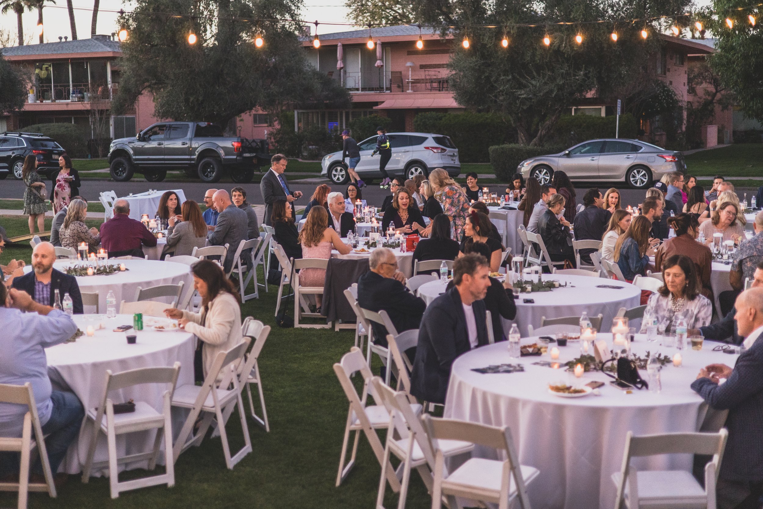 Guests at dinner during a Private Corporate event at the Coronado House a Historic Downtown Phoenix's newest venue, by Professional Corporate Event Photographer; Jennifer Lind Schutsky.