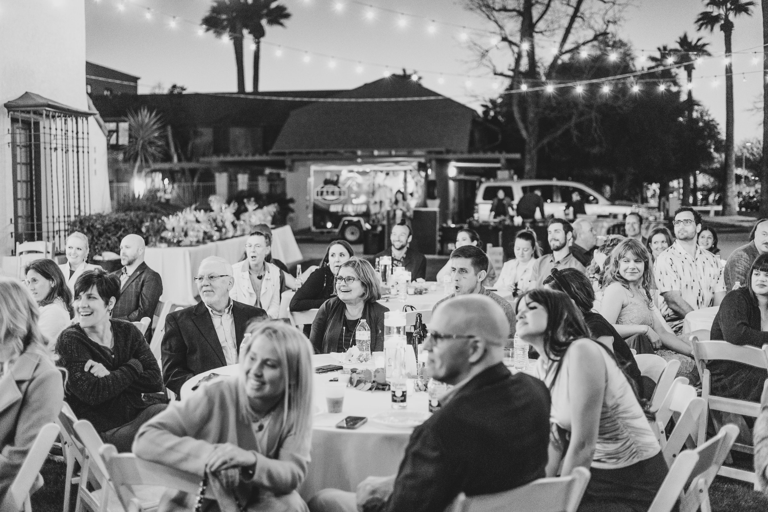Guests at dinner during a Private Corporate event at the Coronado House a Historic Downtown Phoenix's newest venue, by Professional Corporate Event Photographer; Jennifer Lind Schutsky.