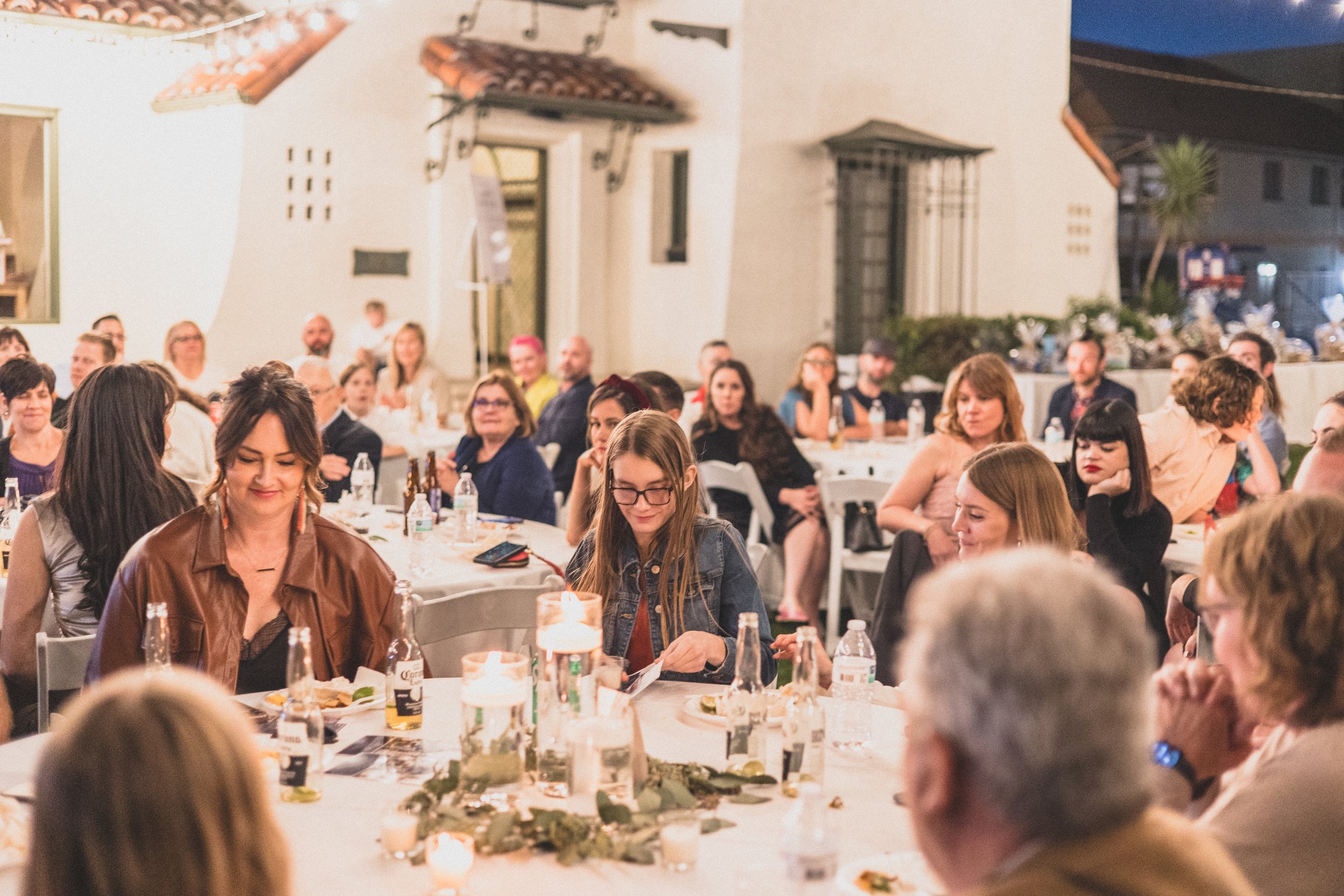 Guests at dinner during a Private Corporate event at the Coronado House a Historic Downtown Phoenix's newest venue, by Professional Corporate Event Photographer; Jennifer Lind Schutsky.