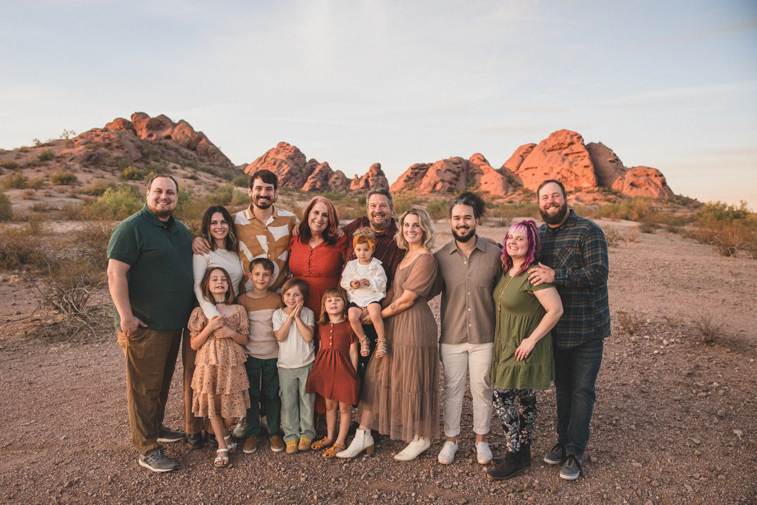Large family pose together at Papago Park Area in Tempe, Arizona by Jennifer Lind Schutsky