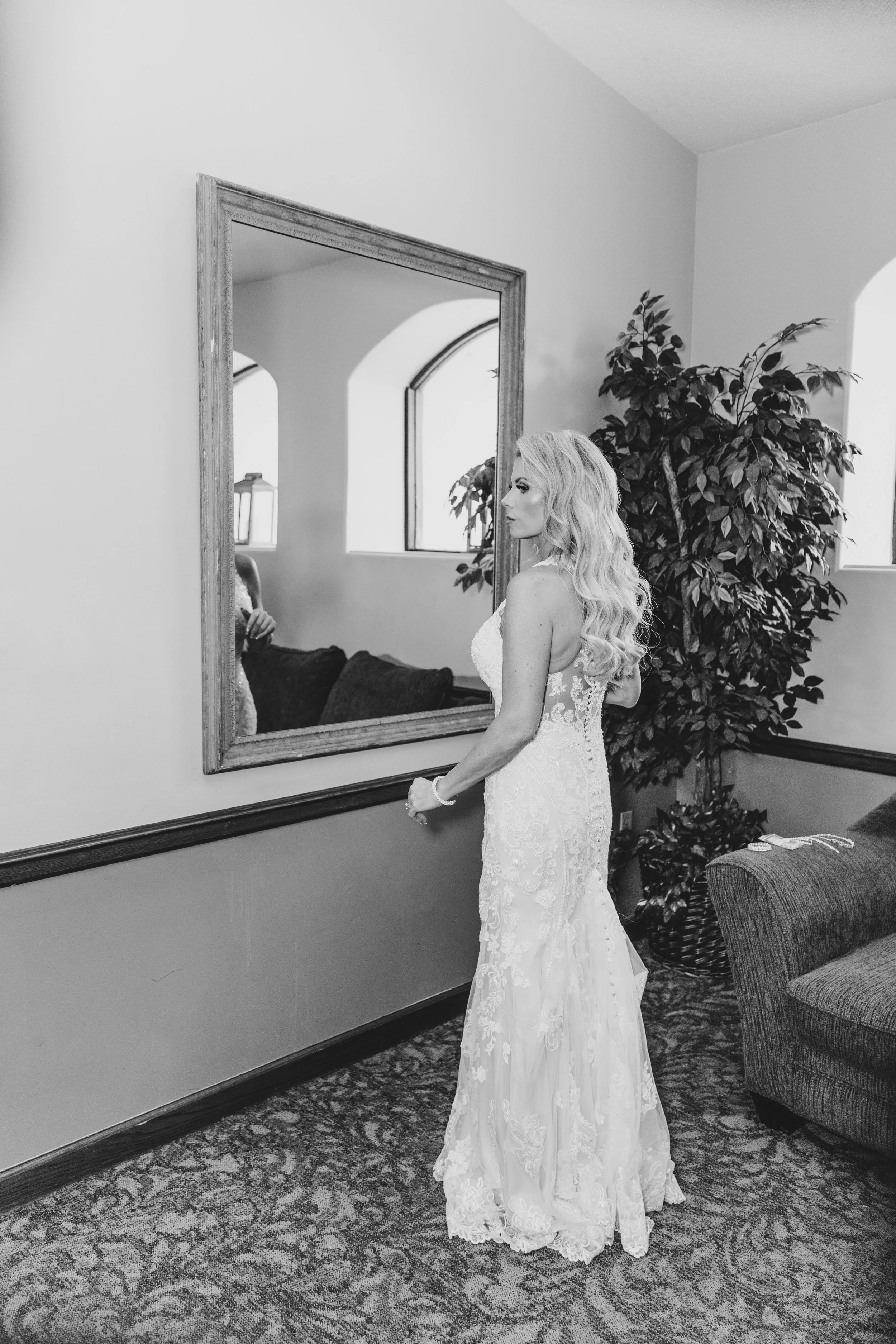 Bride getting ready on her wedding day by experienced wedding photographer in Phoenix, Arizona, Jennifer Lind Schutsky.
