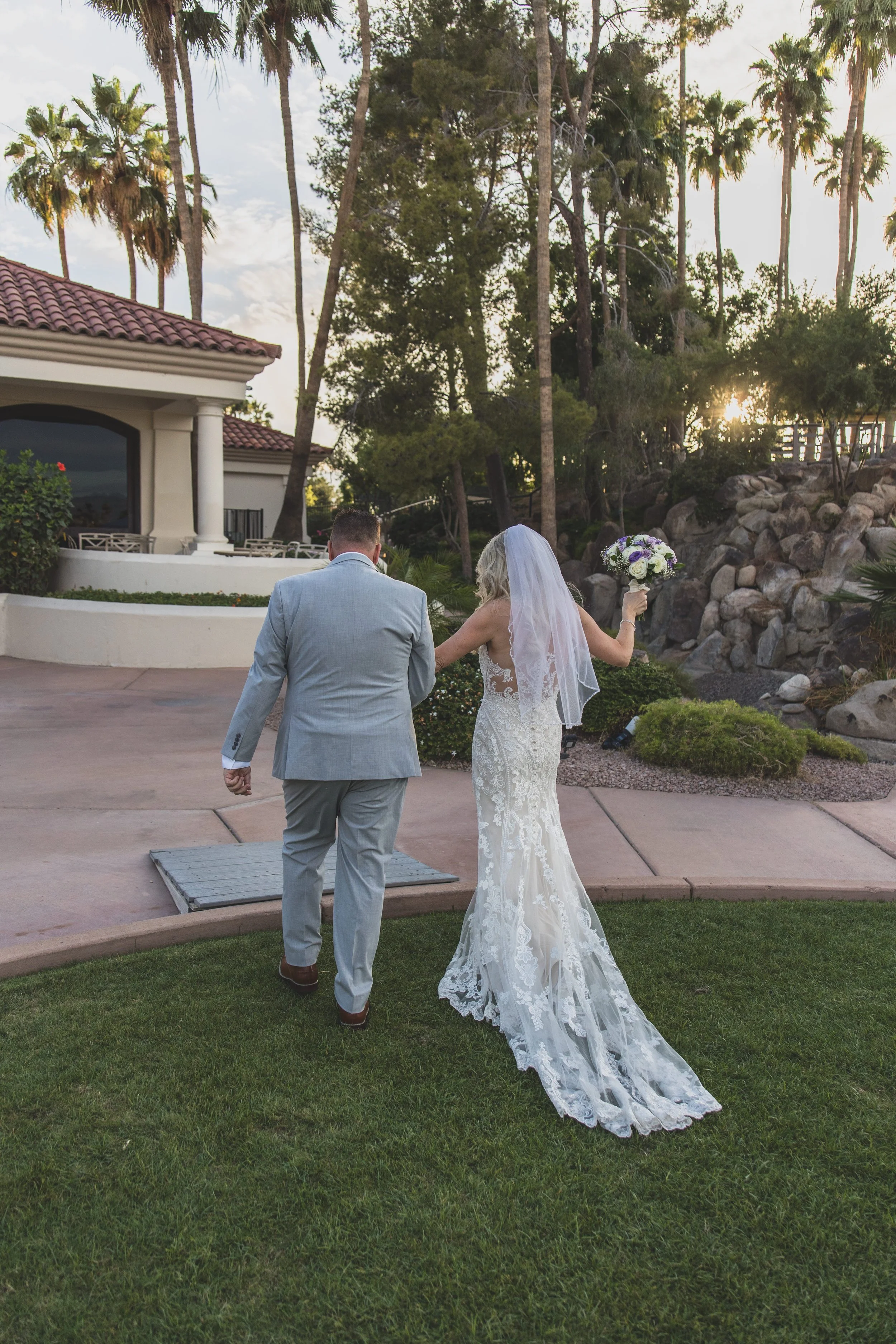 Wedding day ceremony at Val Vista Lakes Event Venue by experienced wedding photographer in Arizona, Jennifer Lind Schutsky.