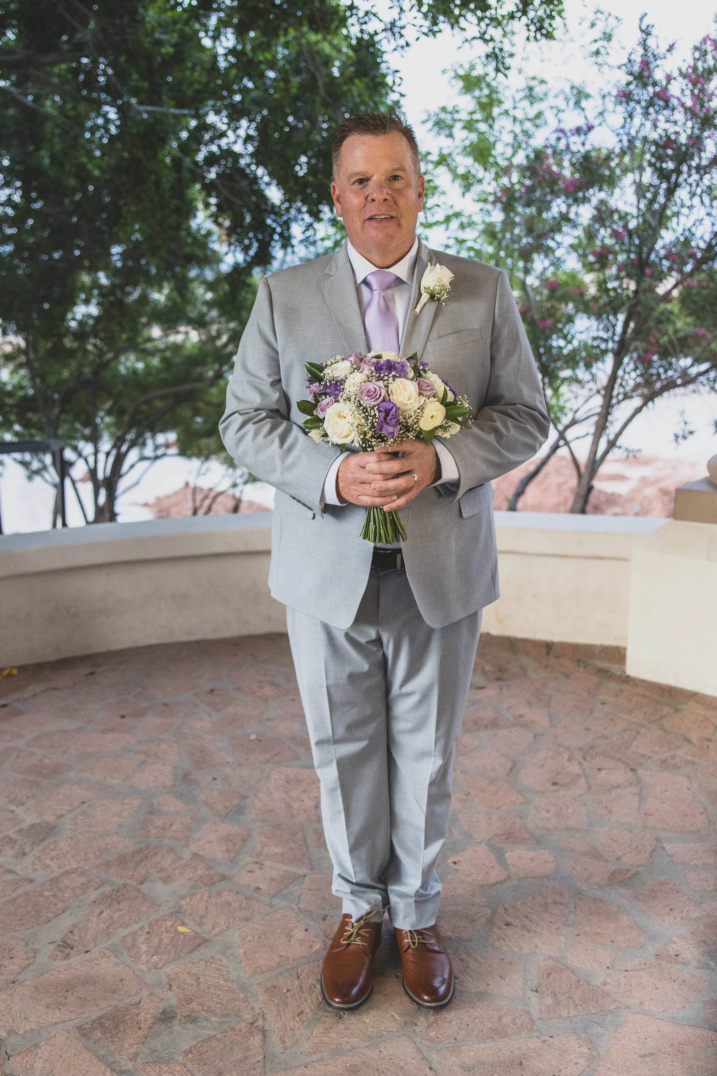 Groom portraits at Val Vista Lakes Event Venue by experienced wedding photographer in Arizona, Jennifer Lind Schutsky.