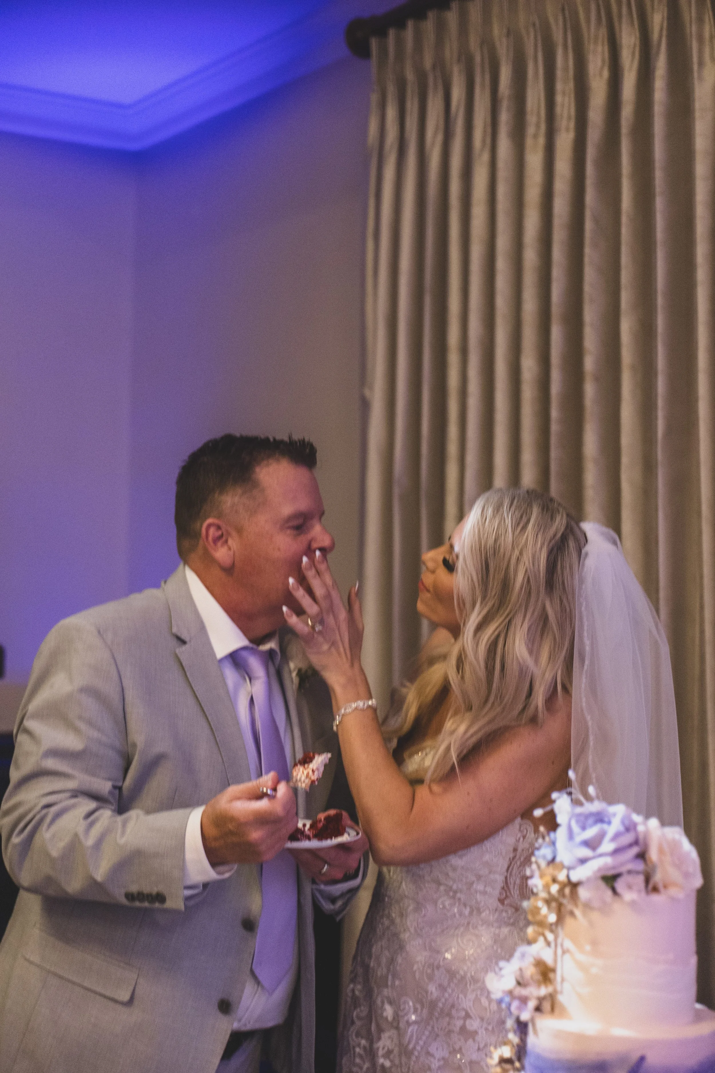 Newlyweds at wedding reception at Val Vista Lakes Event Venue by experienced wedding photographer in Arizona, Jennifer Lind Schutsky.