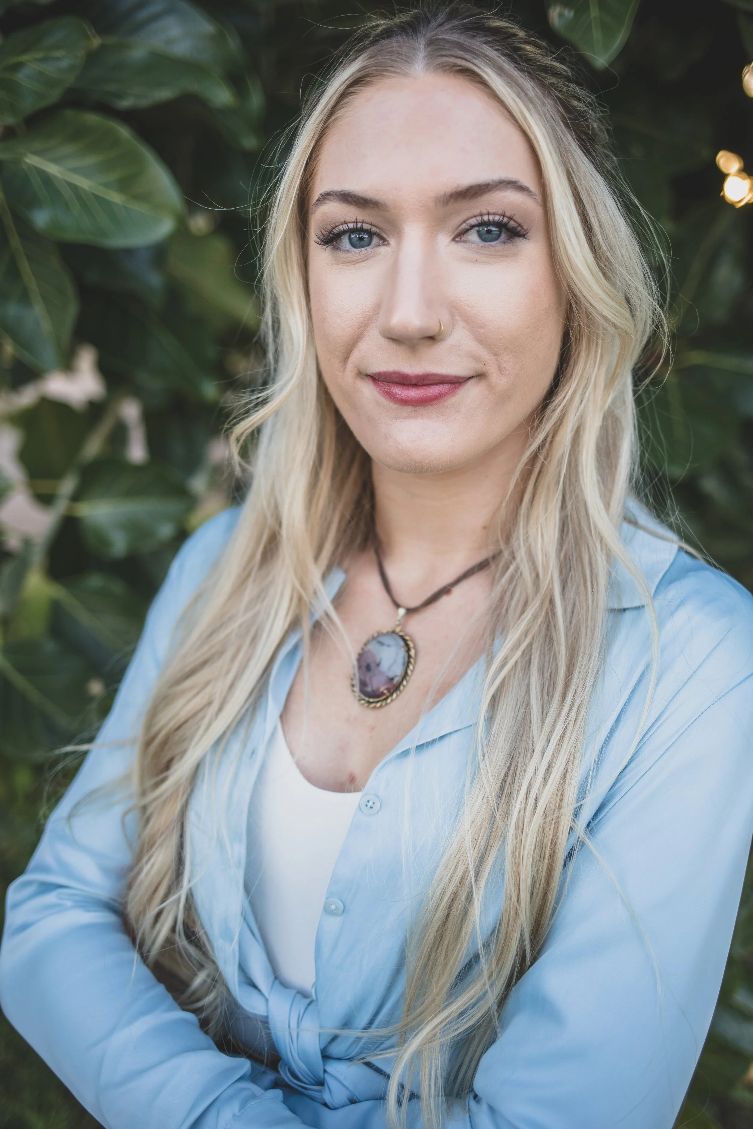 Woman poses in front of natural backdrop at Eldorado Park for professional headshots by Scottsdale based Corporate Branding Photographer, Jennifer Lind Schutsky in Scottsdale, Arizona.