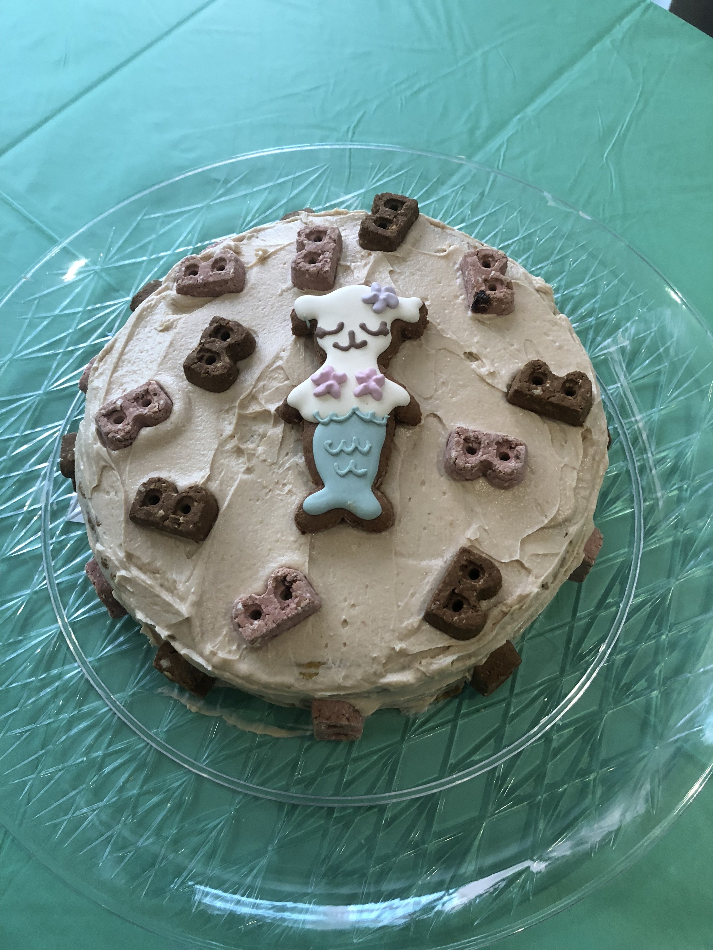 We had lots of human snacks and I made a doggie cake. The recipe is linked here (thanks for the recco @CoopertakesBrooklyn). The treats are from Bocce's Bakery and the mermaid is from our Dapper Dog Box . 