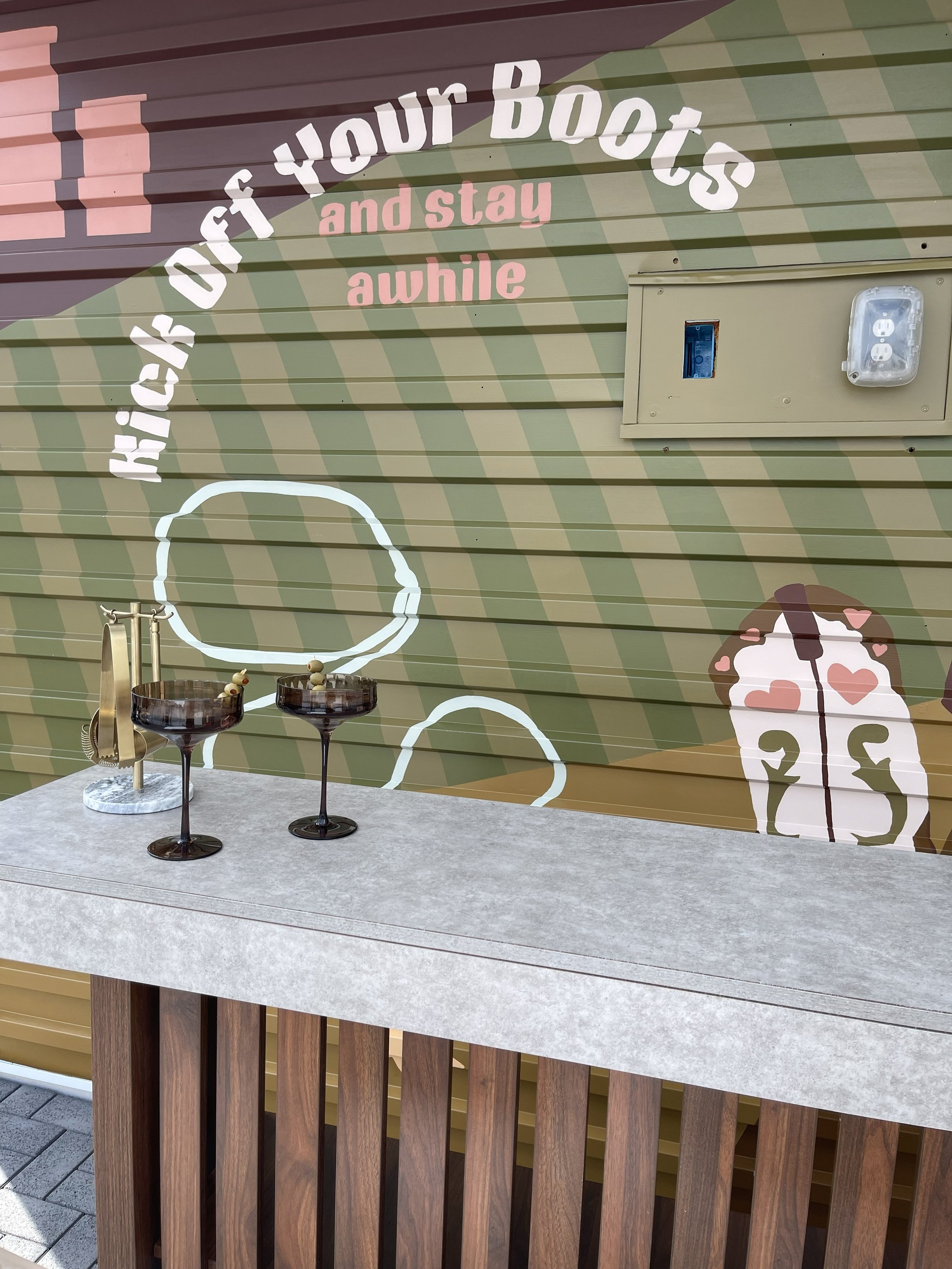 Decorative wall mural, 'kicks off your boots and stay awhile,' Nashville Rooftop Mural