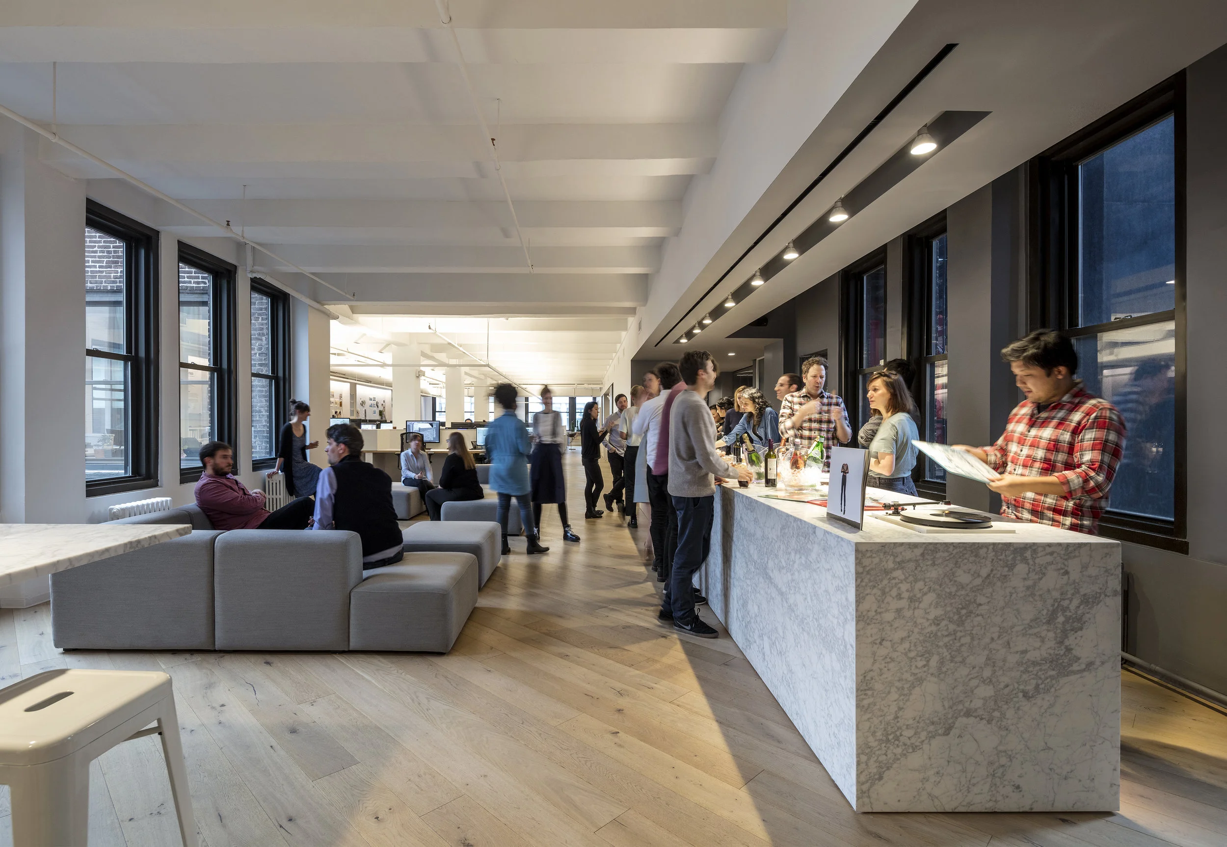 Colleagues enjoy lounging (and drinking) in the center of the office.
