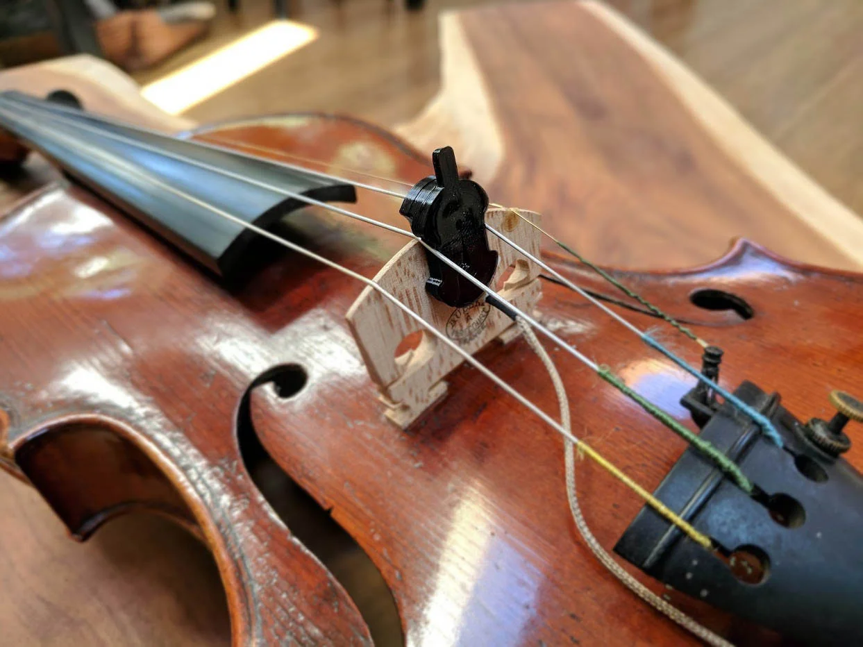 Viol Orchestral Mute mounted for balanced mezzo piano. The viol mute can be placed anywhere across the bridge to fine tune the mezzo piano effect across the instrument’s spectrum.