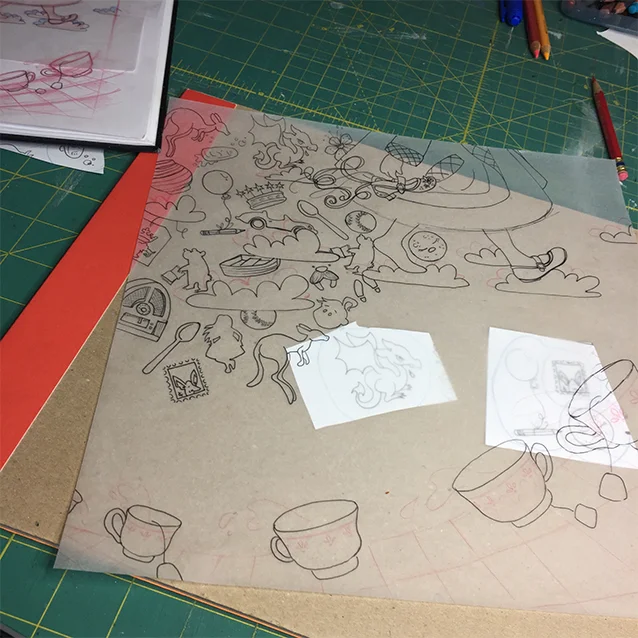 so after i’ve read all the books, i go back through my margin notes and pick out the shapes to fill in the background pattern with that allude to adventures from the tale. so after i have those drawn, i use a sheet of tracing paper (11×11,” same size as my final painting) to re-trace the shapes and fit them all together within my composition.
