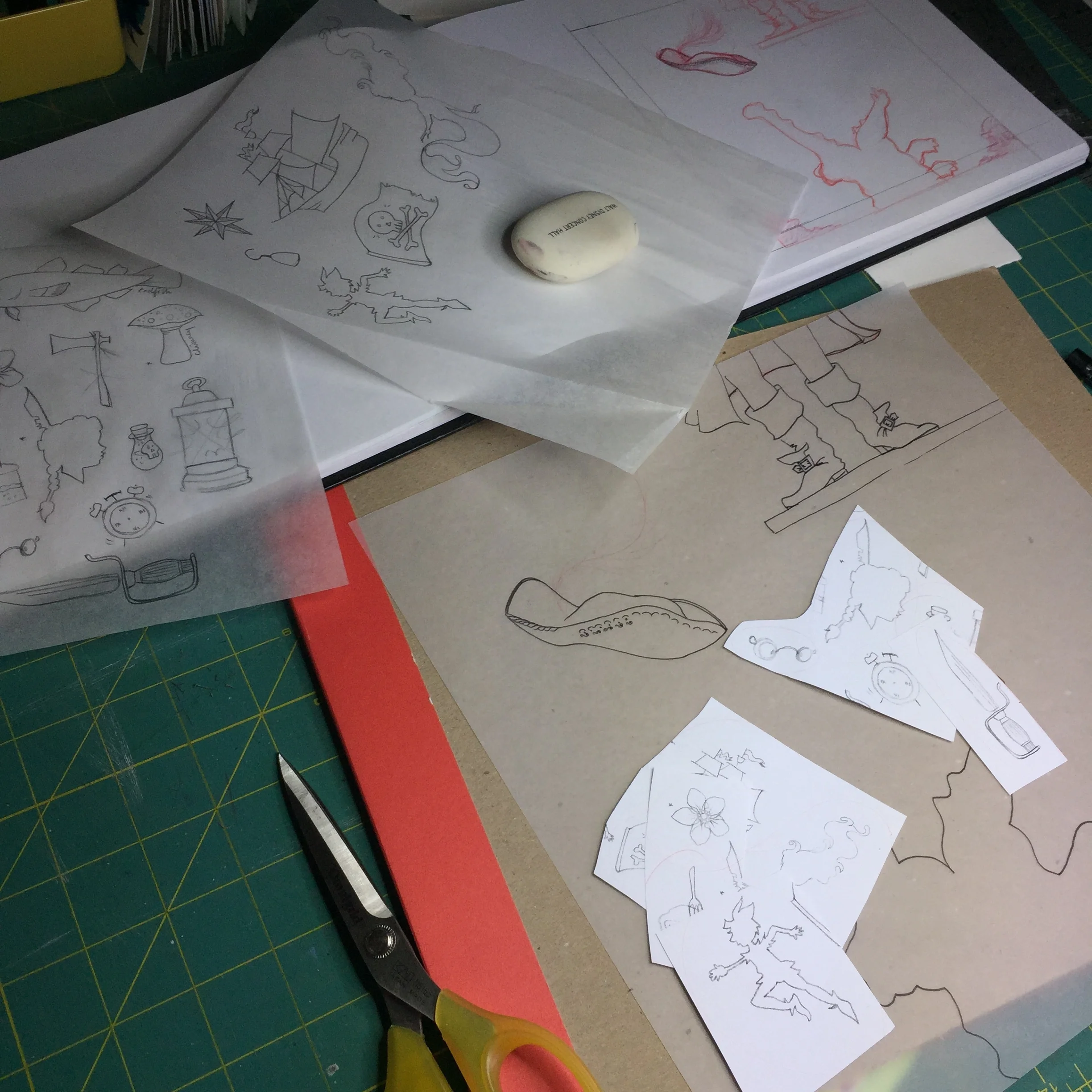 after my layout is finalized, i photocopy the story icon silhouettes from my sketchbook to the scale i want them....