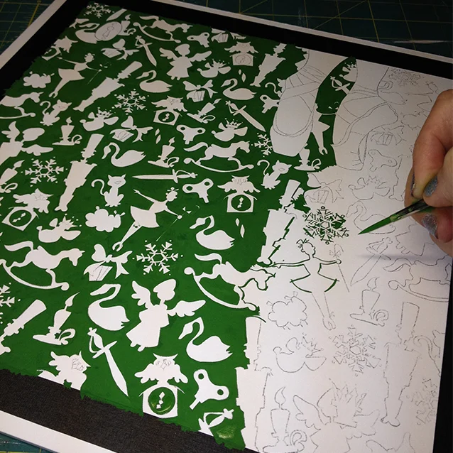 again- why are they so tiny?! i started with filling in the background around all the icons with a sturdy, true holiday green. (yes, it took ForEvER. and i cannot answer for how i kept those snowflakes so neat. ha!) ;)