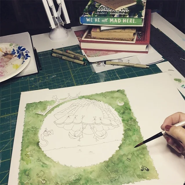 once i had my final sketch, i transferred it to watercolor paper and started painting in layers of green foliage for the hedges.