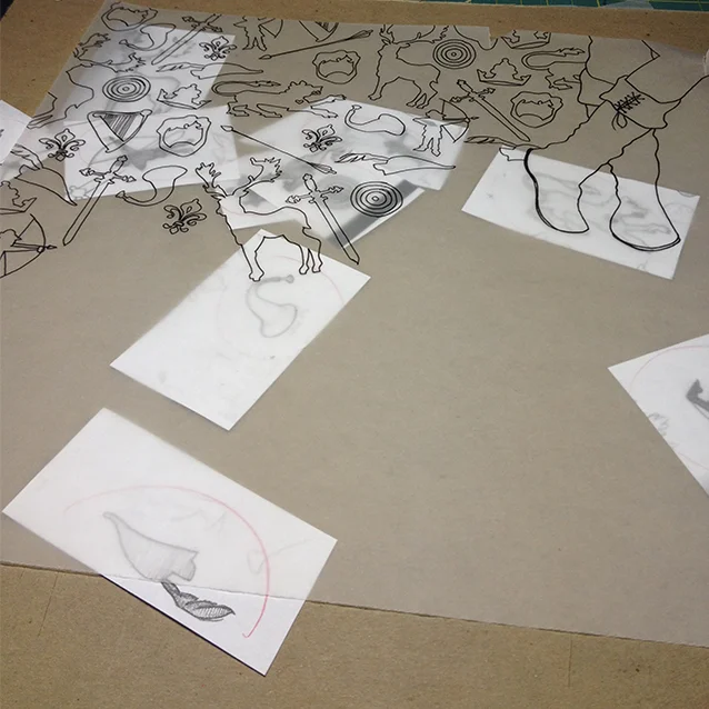 beginning to trace all the icon shapes onto robin’s tracing paper to create a full pattern.