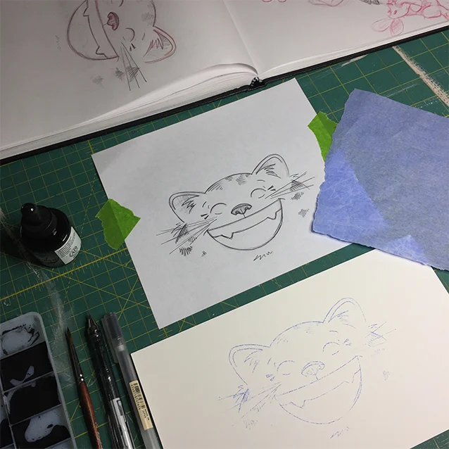 for the pencil zipper pouches (great for art on the go, or, like me, they also double as a purse clutch!), i did pen and ink of the cheshire cat and the mad hatter… i photocopy my original sketch, use carbon paper to transfer it down to my illustration board, then use ink to finalize the drawing!