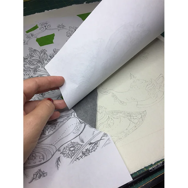 once i have my full drawing, i blew it up to the scale i wanted to paint it (you can see my photo copies spliced together; i’m totally hi*tech over here), and used a piece of graphite paper to transfer all the details down to my watercolour paper.