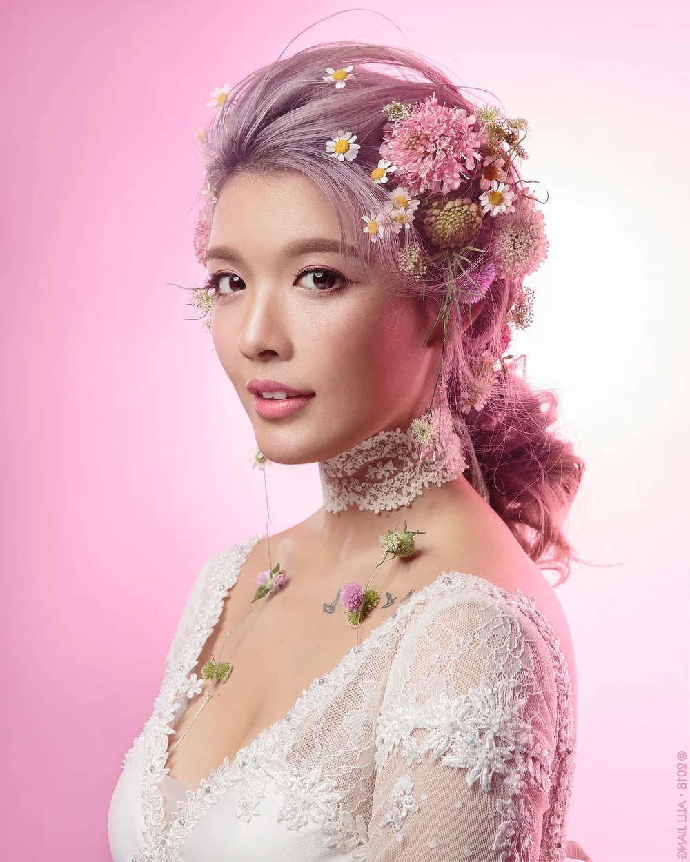 Creative beauty portrait with lavender hair, fresh flowers and antique lace