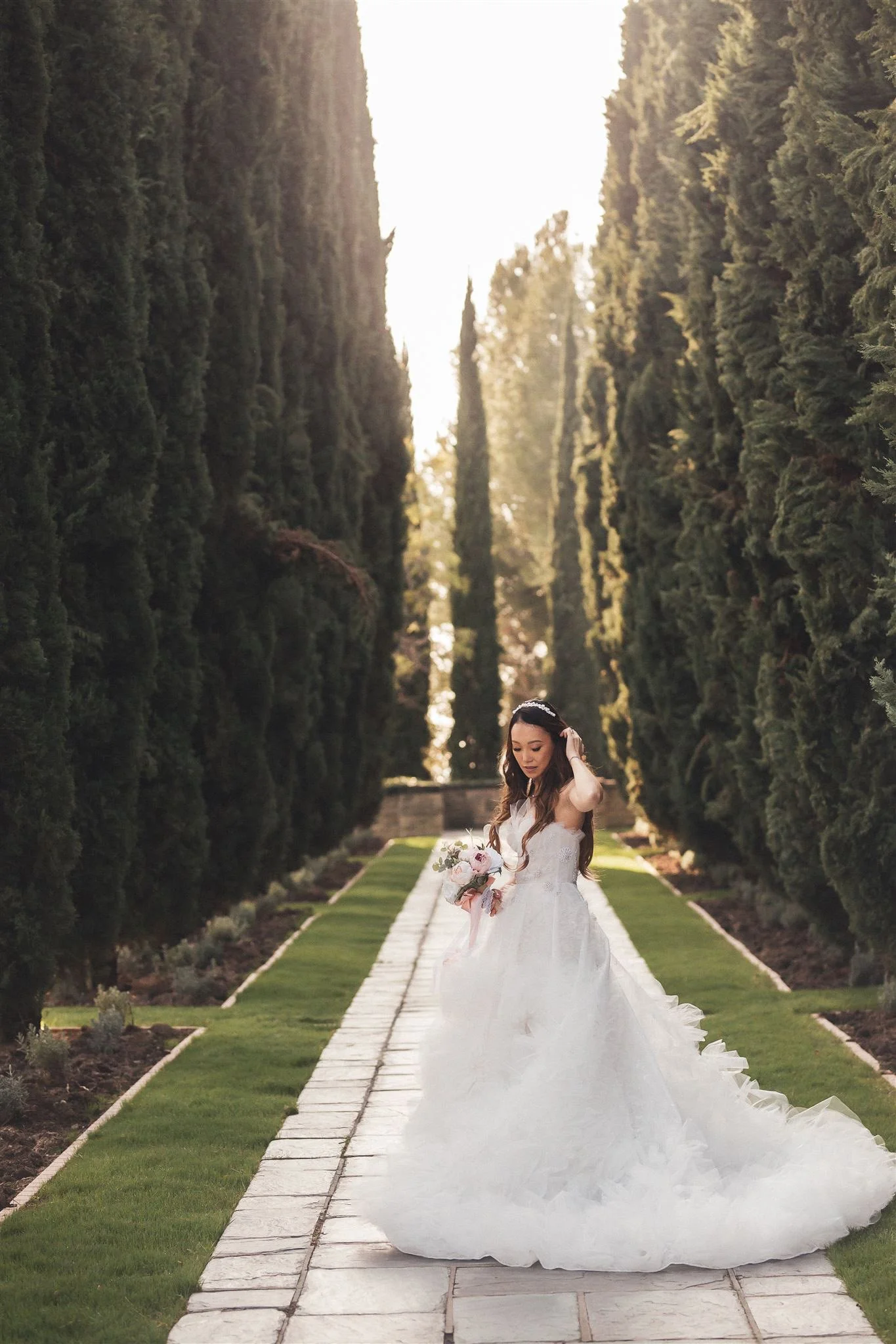 Bride in the cypress allee at Greystone Mansion, Beverly Hills