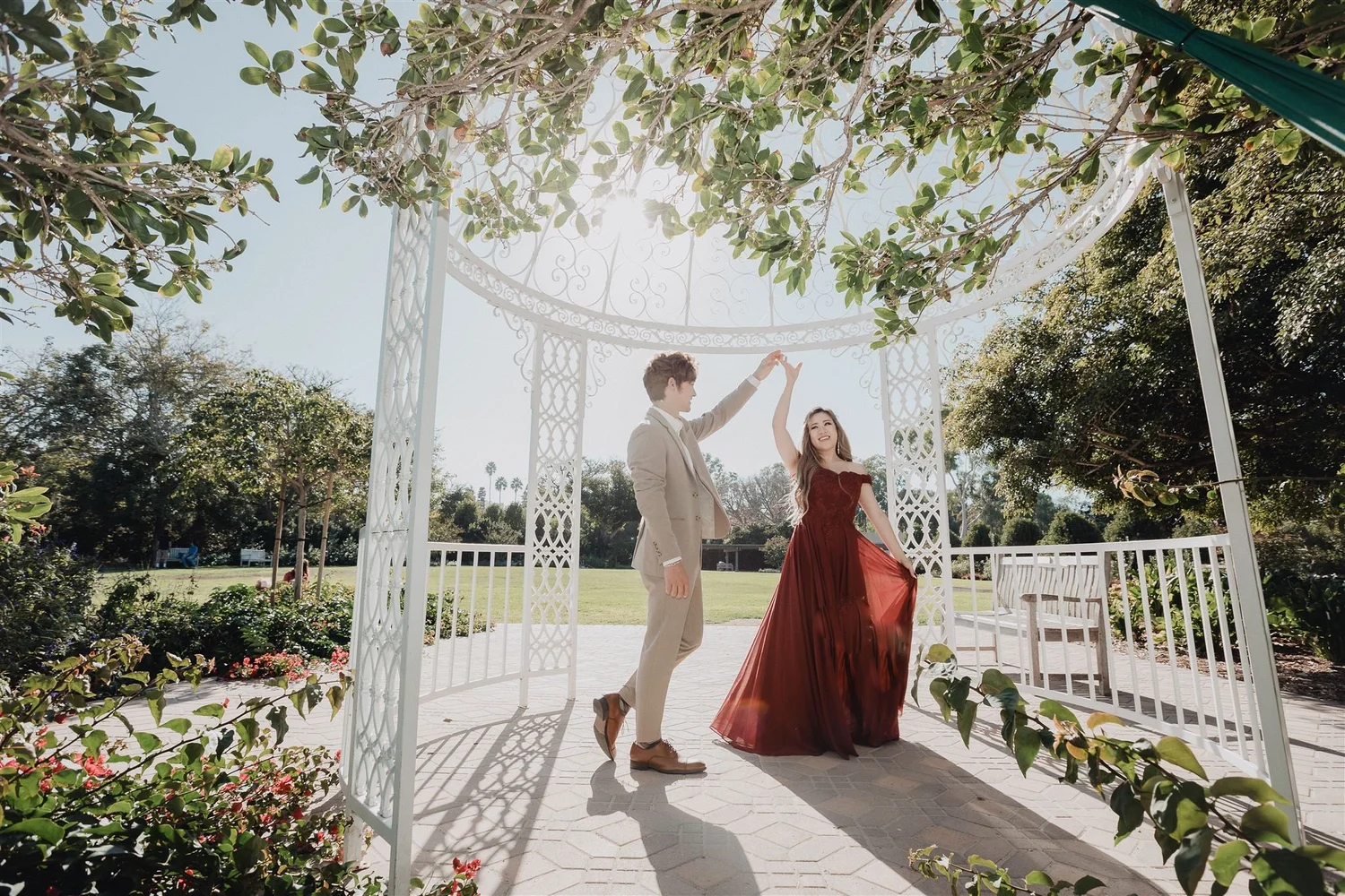 Couple beneath a garden pergola, photographed by Lulan Studio