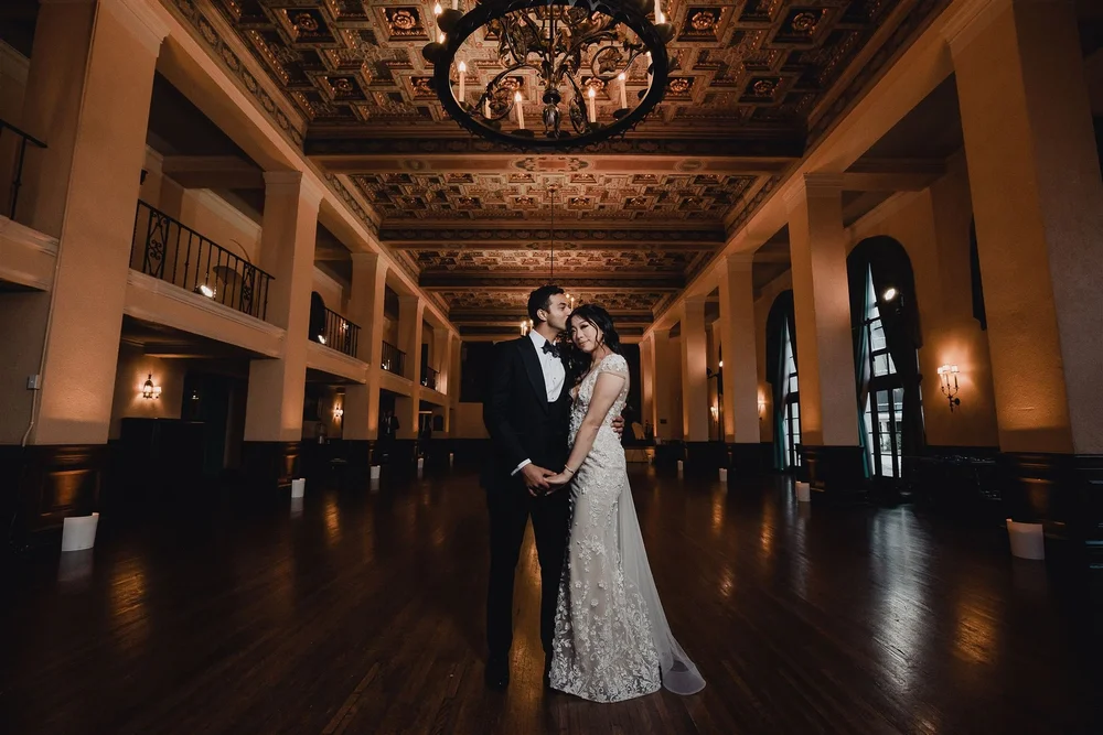 Couple in a candlelit ballroom, photographed by Lulan Studio