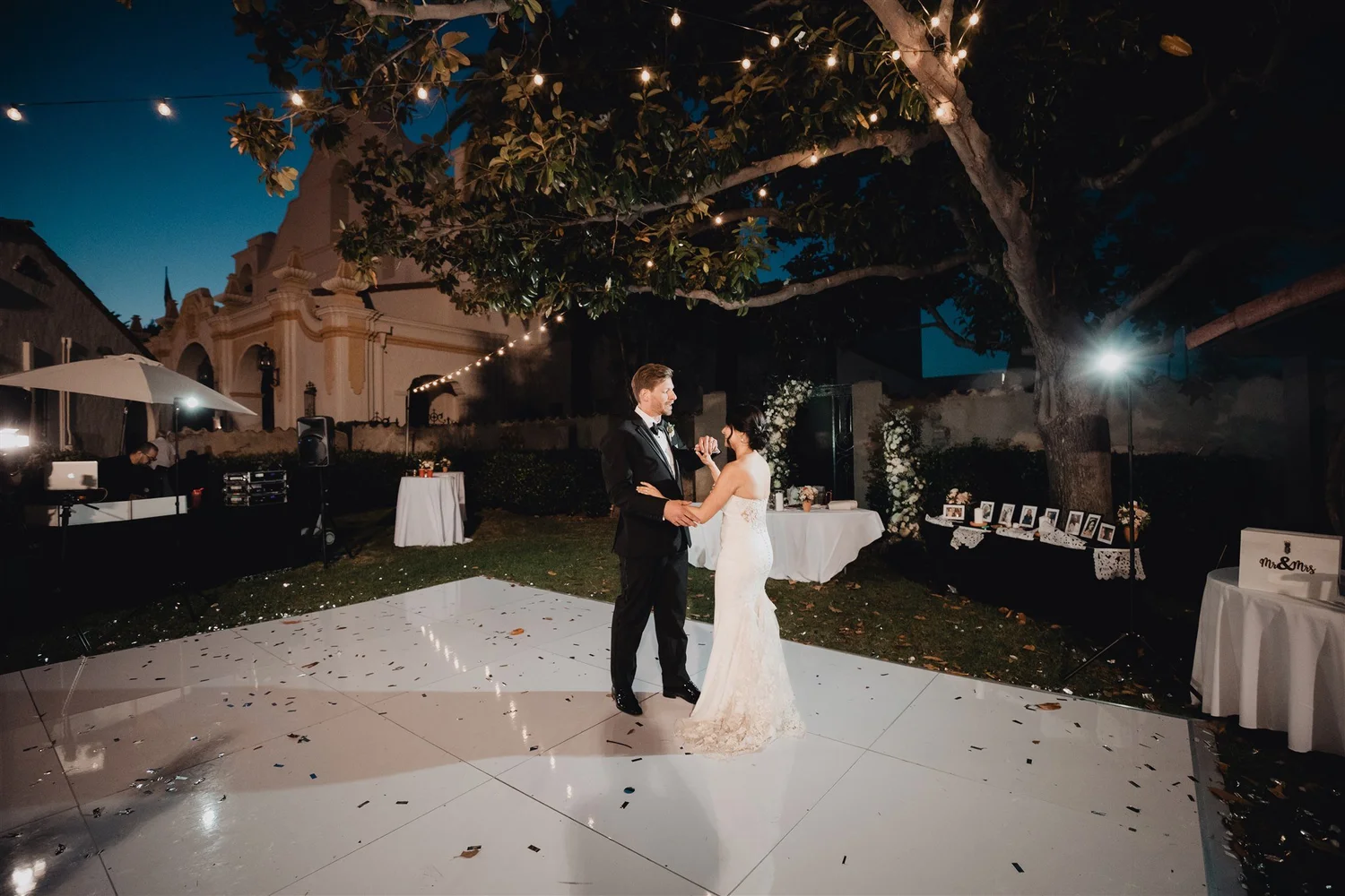 First dance on an outdoor floor under string lights and trees at night, Grapevine Arbor