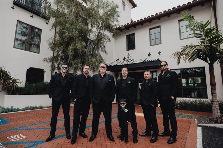 Groom getting ready with his groomsmen before a Santa Barbara wedding, photographed by Lulan Studio