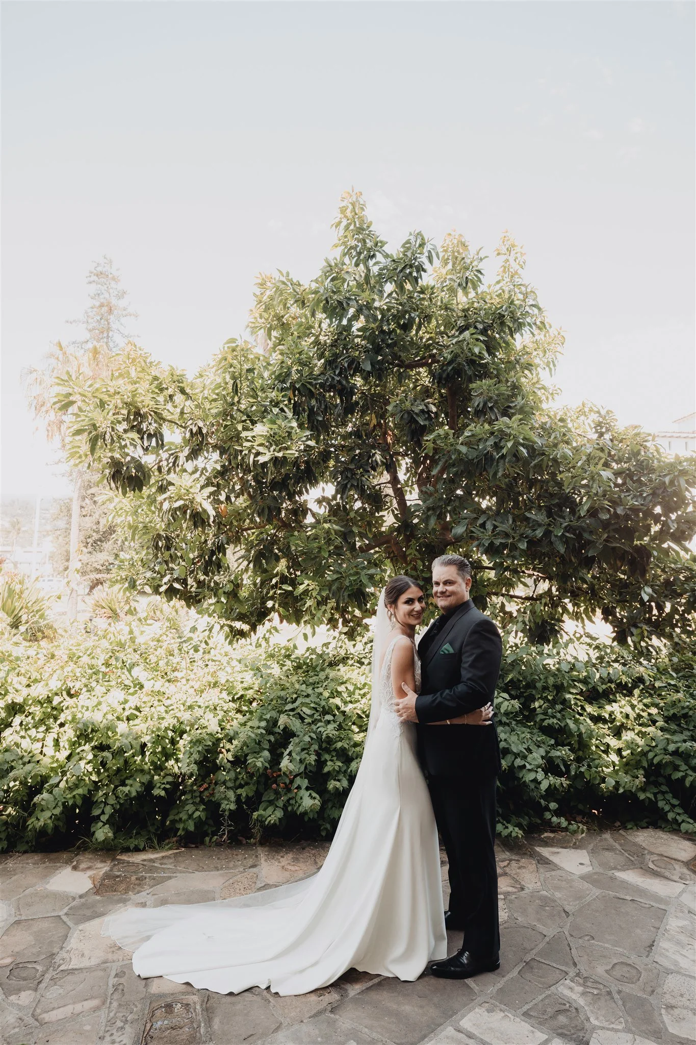 Couple standing together in the sunken garden of the Santa Barbara County Courthouse