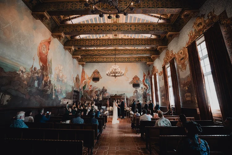 Wedding ceremony in the painted Mural Room at the Santa Barbara County Courthouse