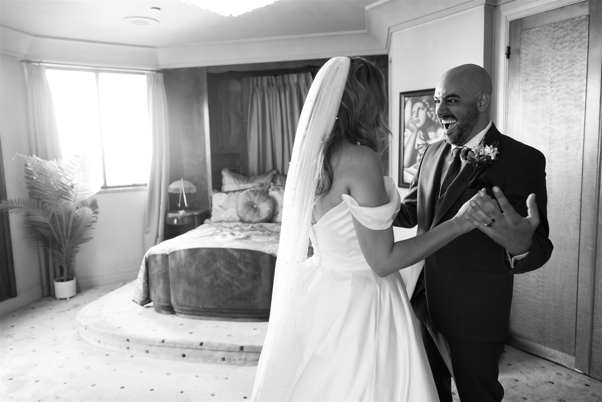 First Look with Bride and Groom at Oviatt Penthouse, wedding photo taken by Lulan Studio