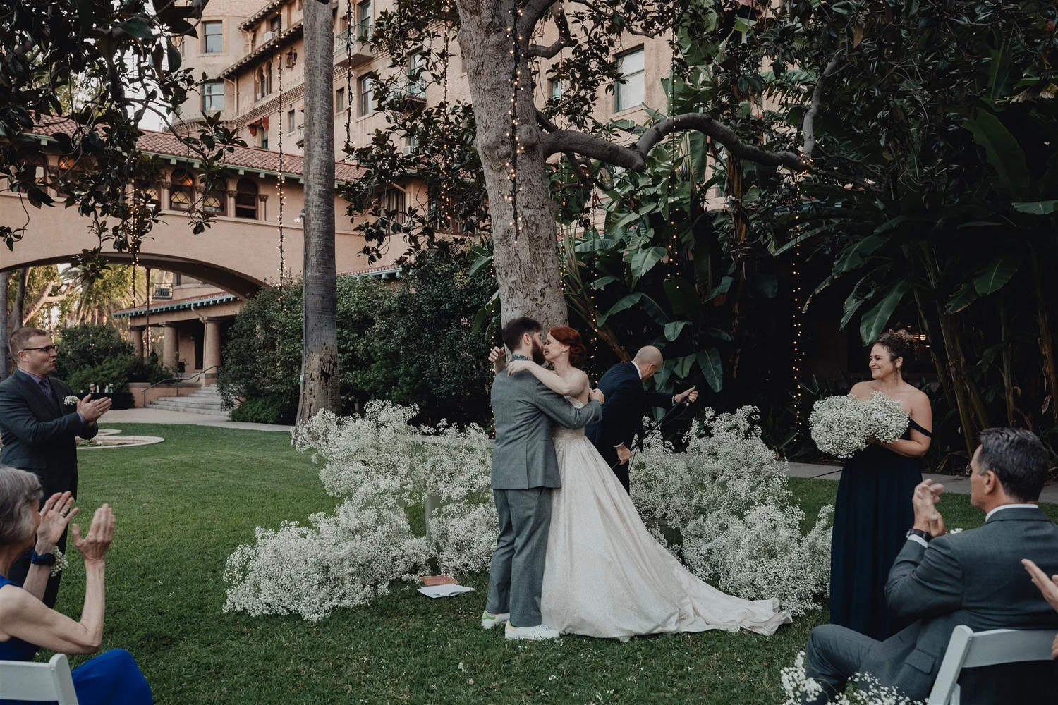 Garden ceremony on the lawn under the palms at Castle Green in Pasadena