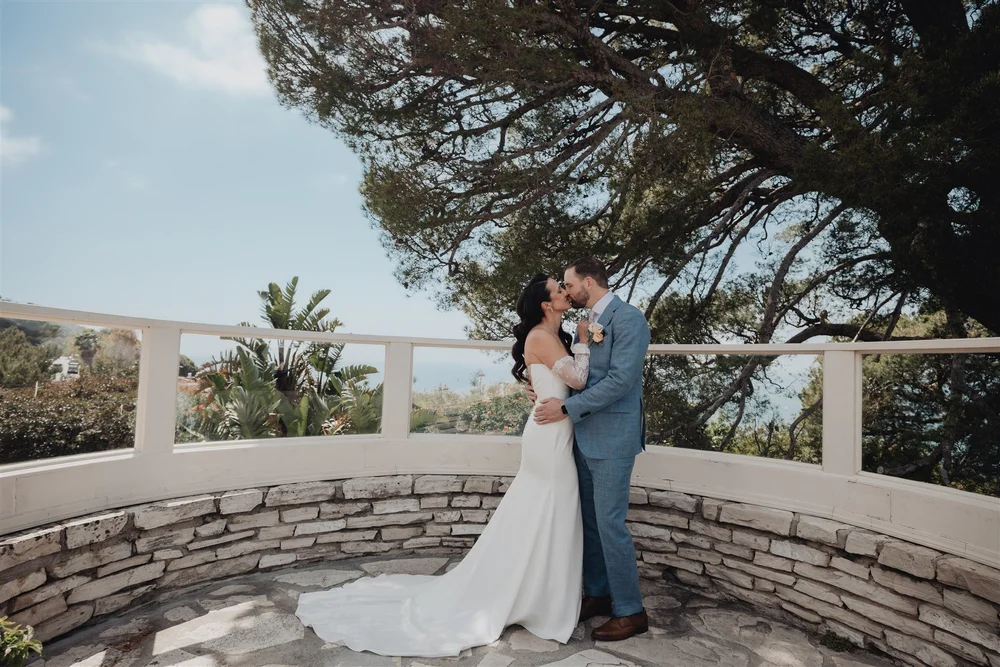 Couple embracing on the stone terrace at La Venta Inn
