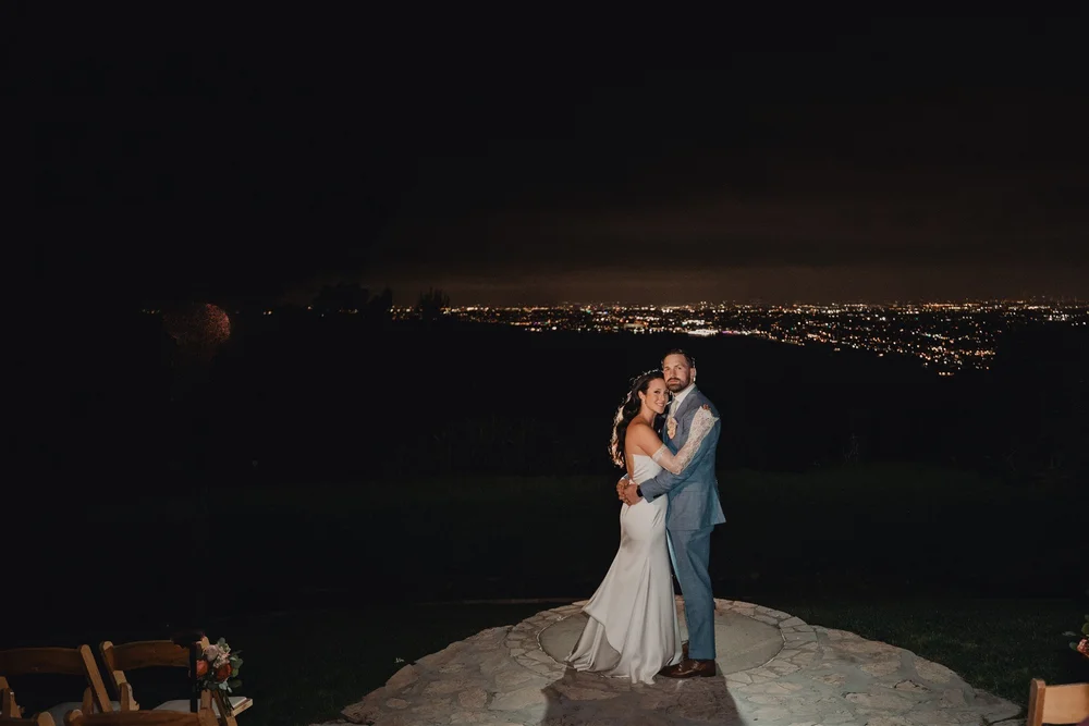 Night portrait on the La Venta Inn ceremony circle above the city lights