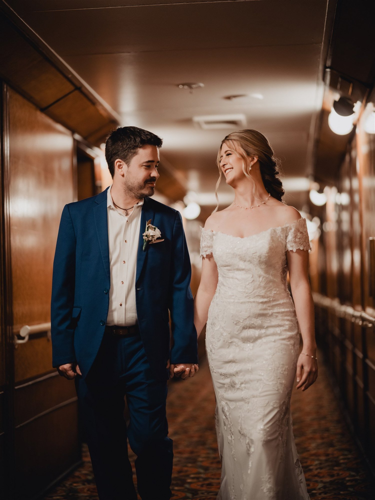A couple dancing in warm light at their Los Angeles wedding reception.