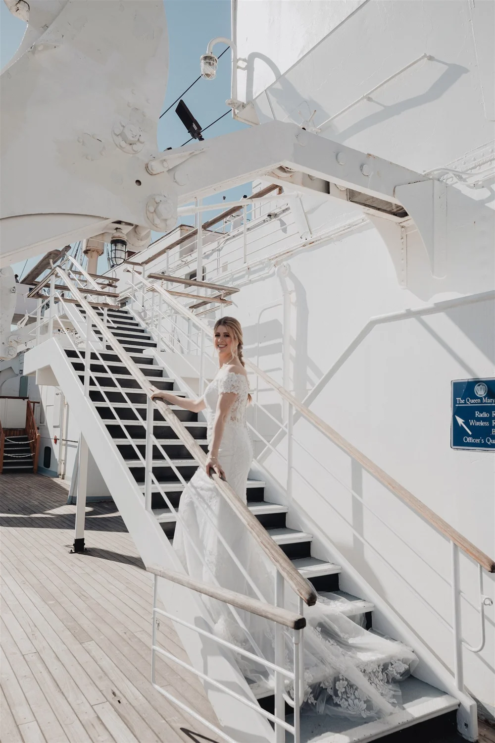 Bride on the white steel staircase of the Queen Mary’s sun deck