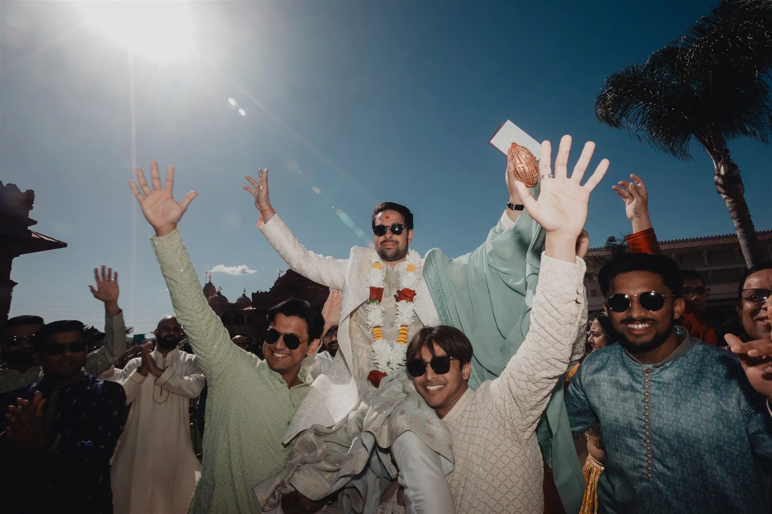 Baraat with dancing guests on the grounds of the BAPS mandir in Chino Hills