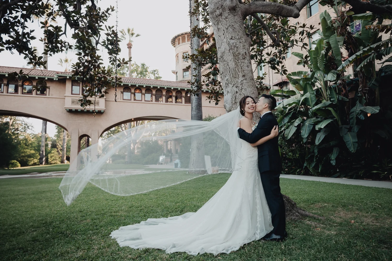 Veil lifting in the wind in the arched courtyard at Castle Green, black and white