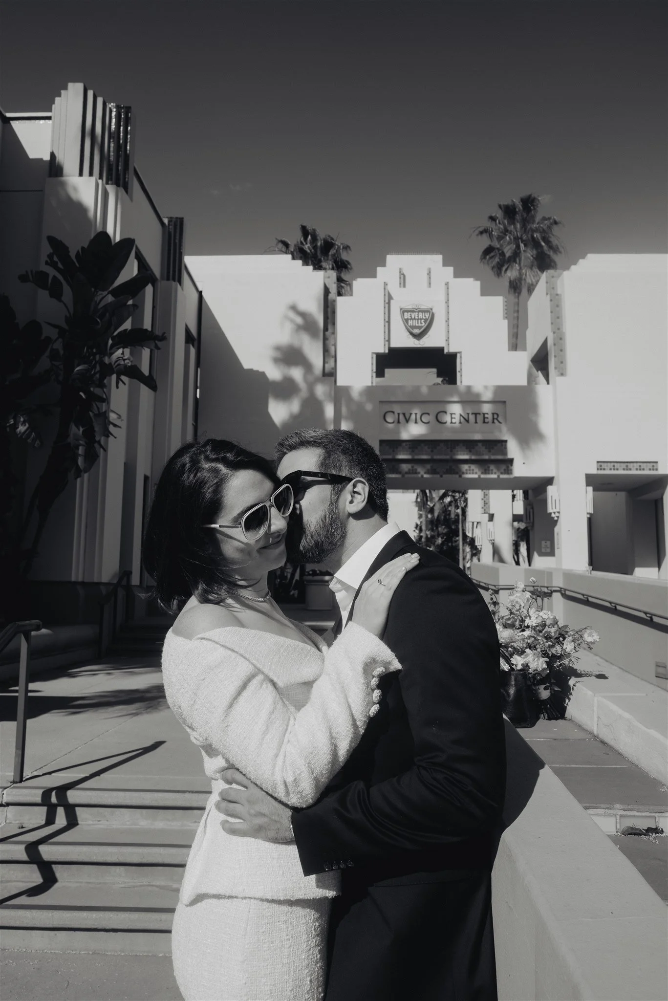 Black and white portrait of a couple embracing after their intimate Los Angeles civil ceremony