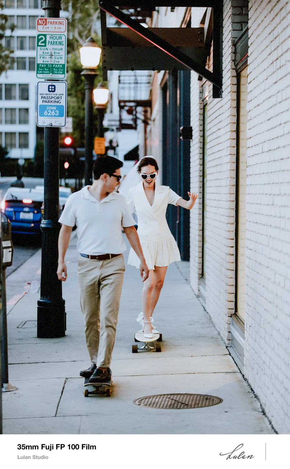 35mm Fuji FP-100 film — couple walking a downtown Los Angeles sidewalk