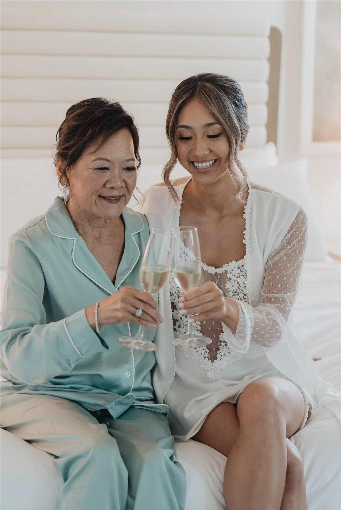 bride and her bridesmaids getting ready robes on her wedding day at skirball cultural center