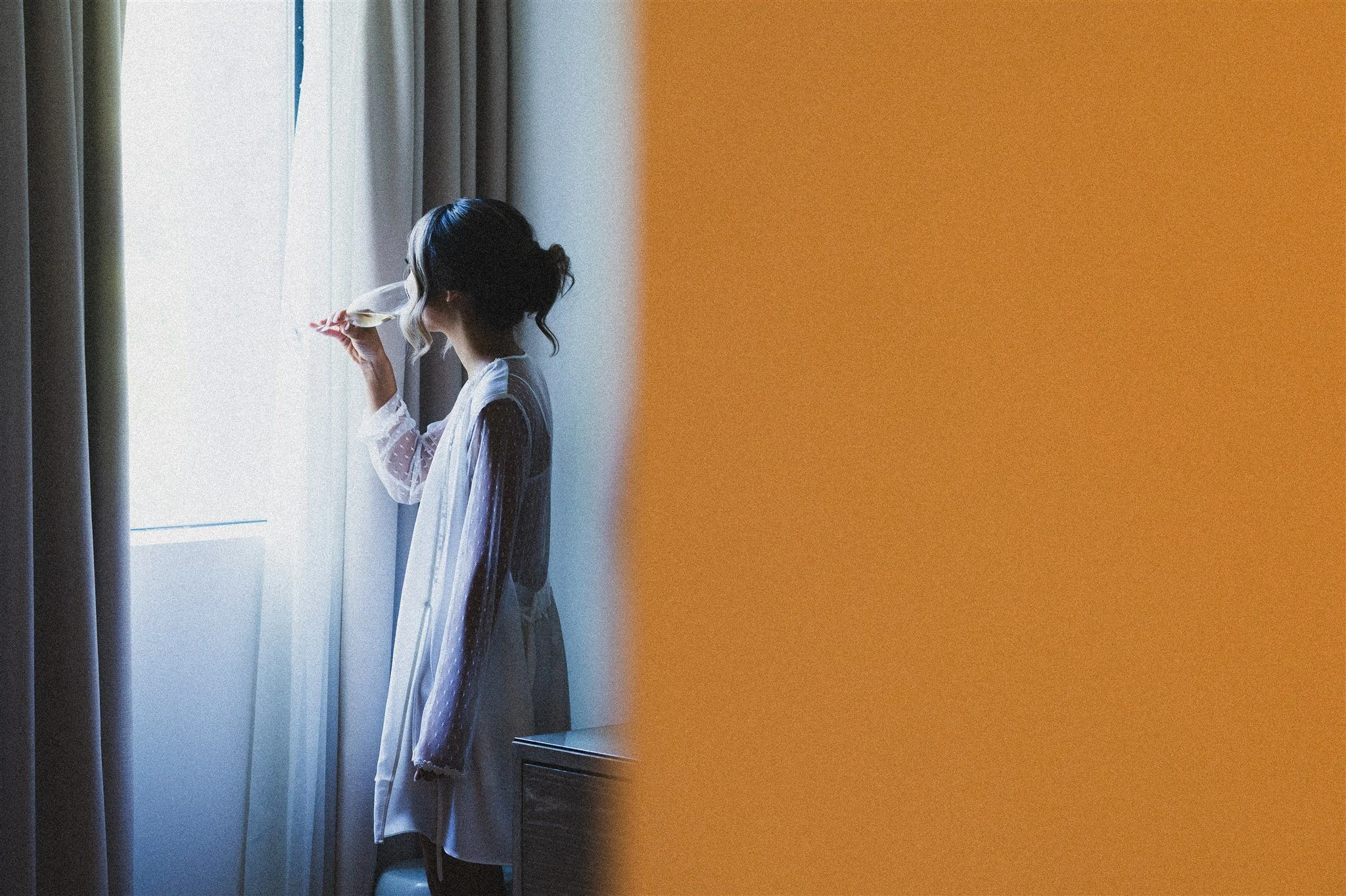 bride getting ready robes on her wedding day at skirball cultural center