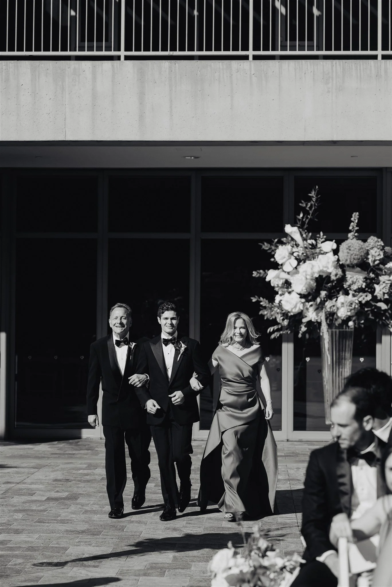 groom walking down the aisle for his wedding ceremony at skirball cultural center